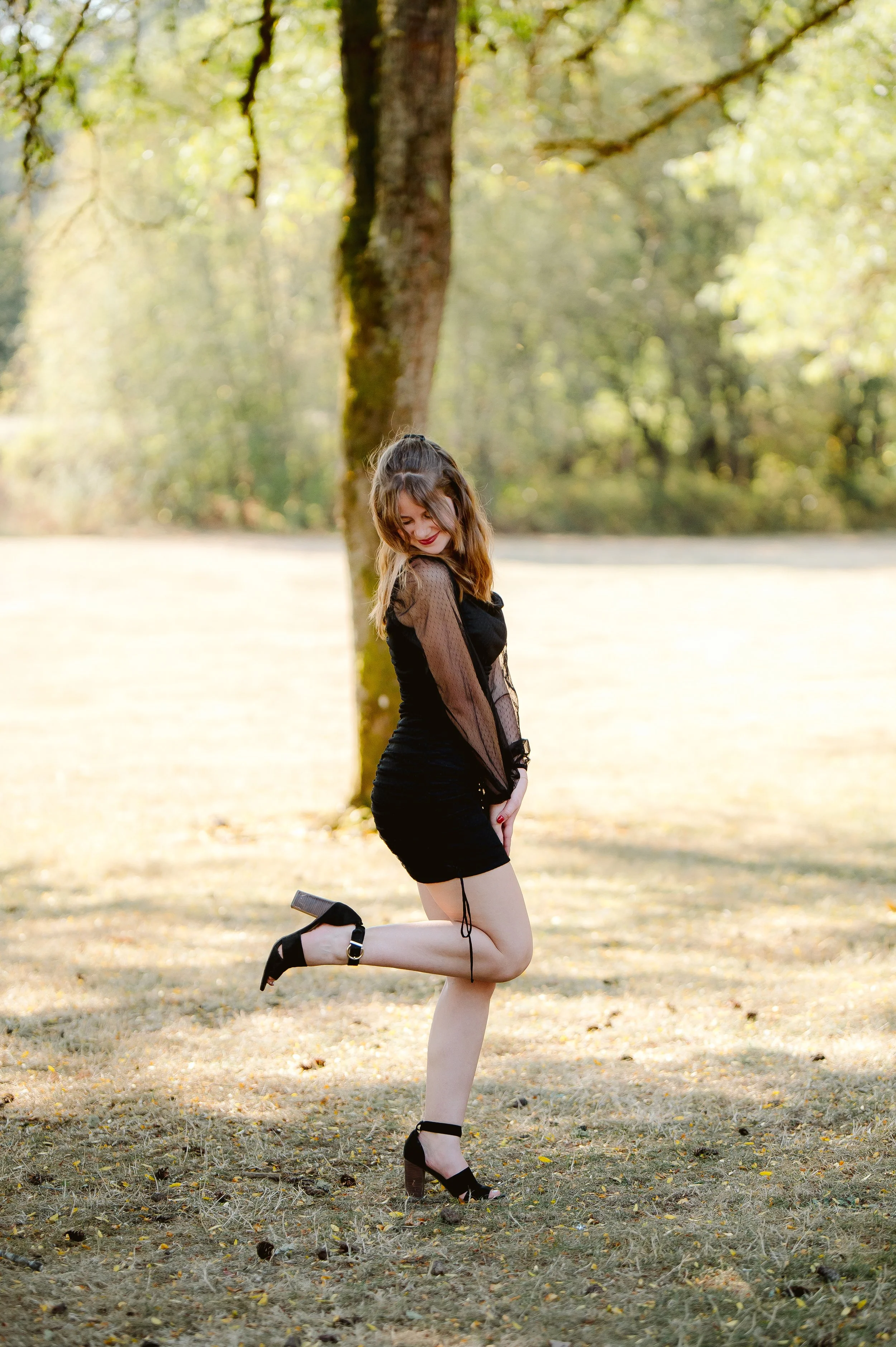 High school senior girl laughing naturally during candid outdoor senior photo session in Vancouver Washington