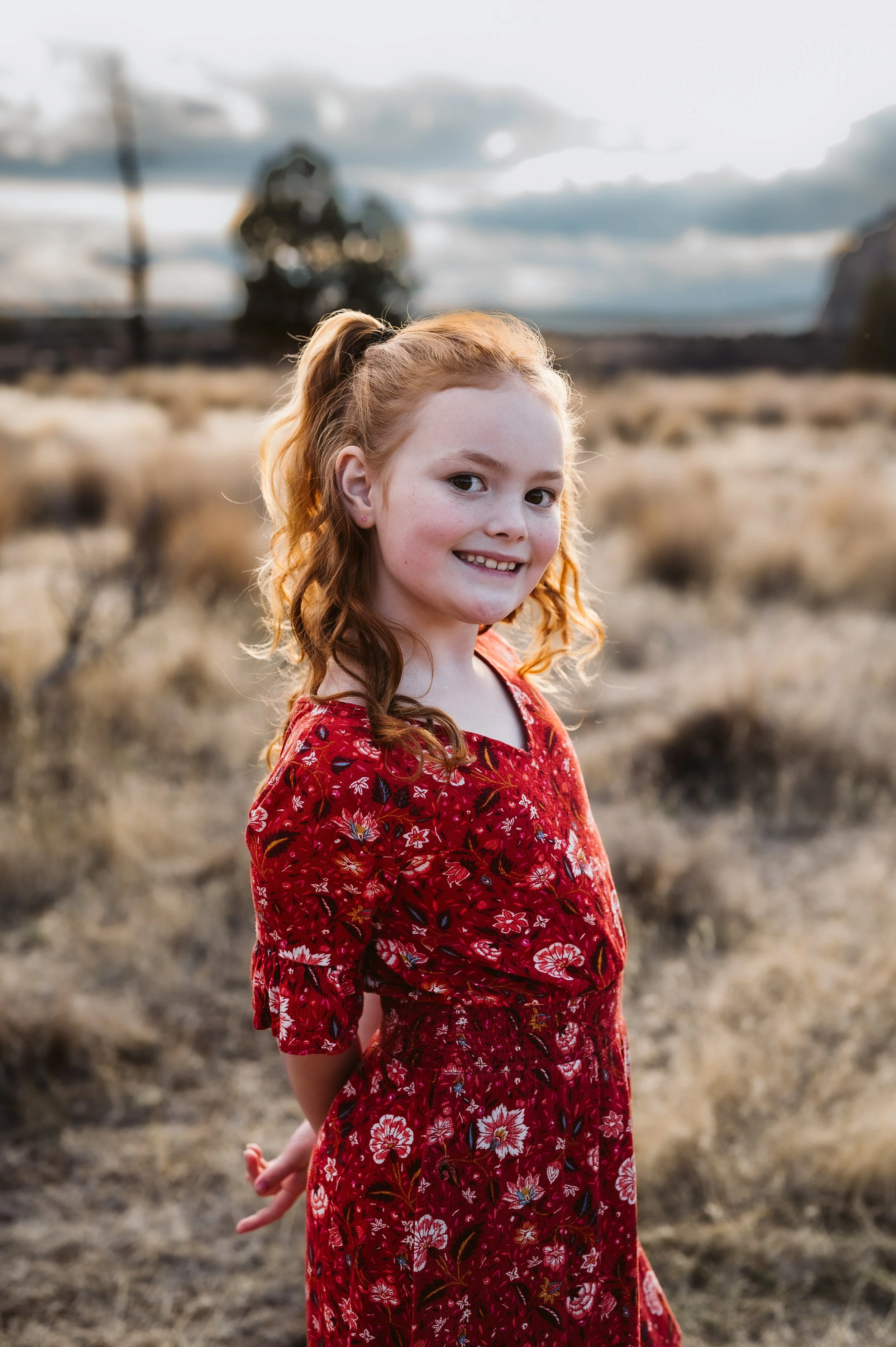 Outdoor family photography portrait captured by a Vancouver Washington photographer in a natural open field.
