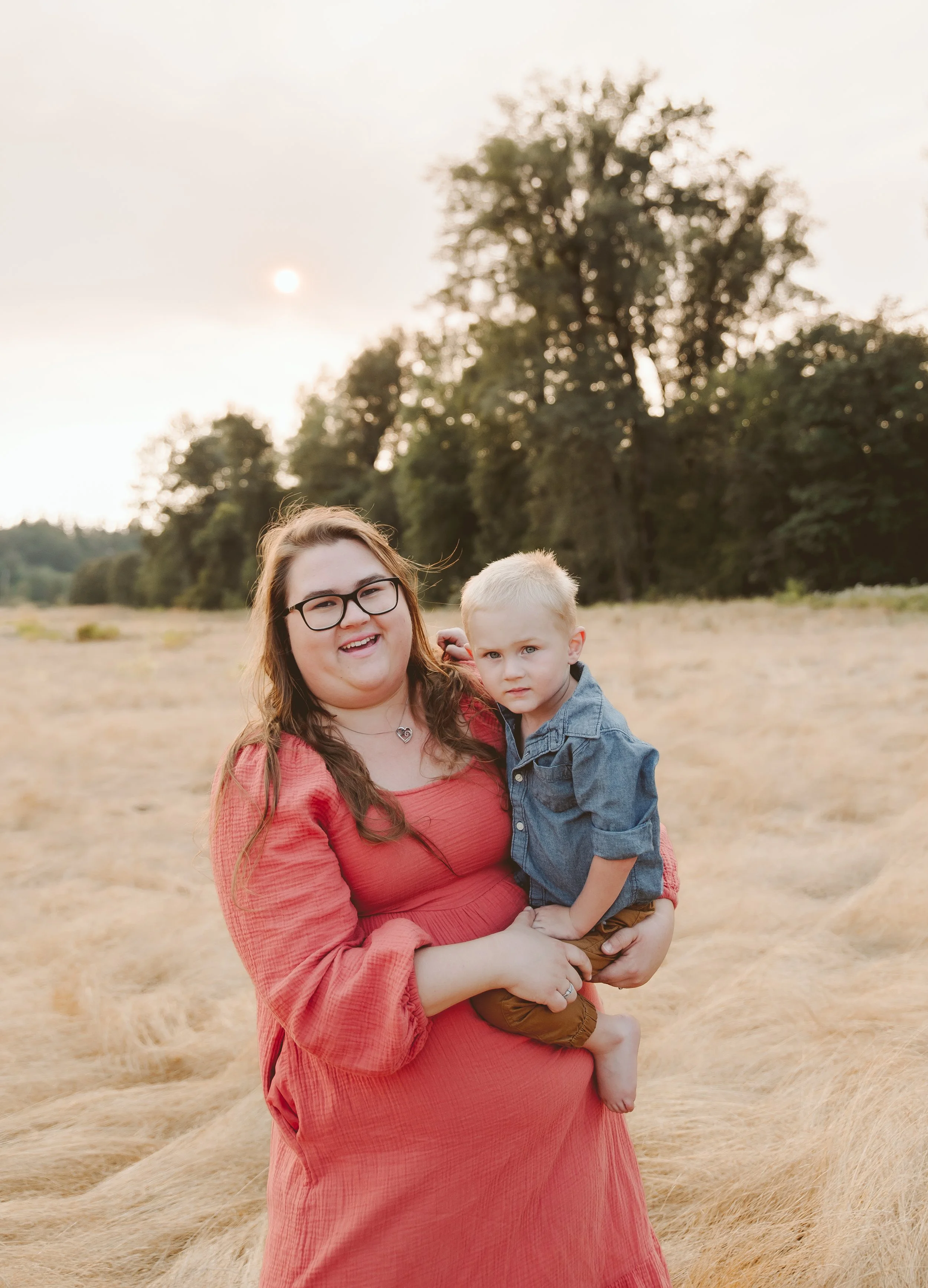 Mother and child lifestyle portrait at sunset in an open field, captured by a Vancouver Washington family photographer.
