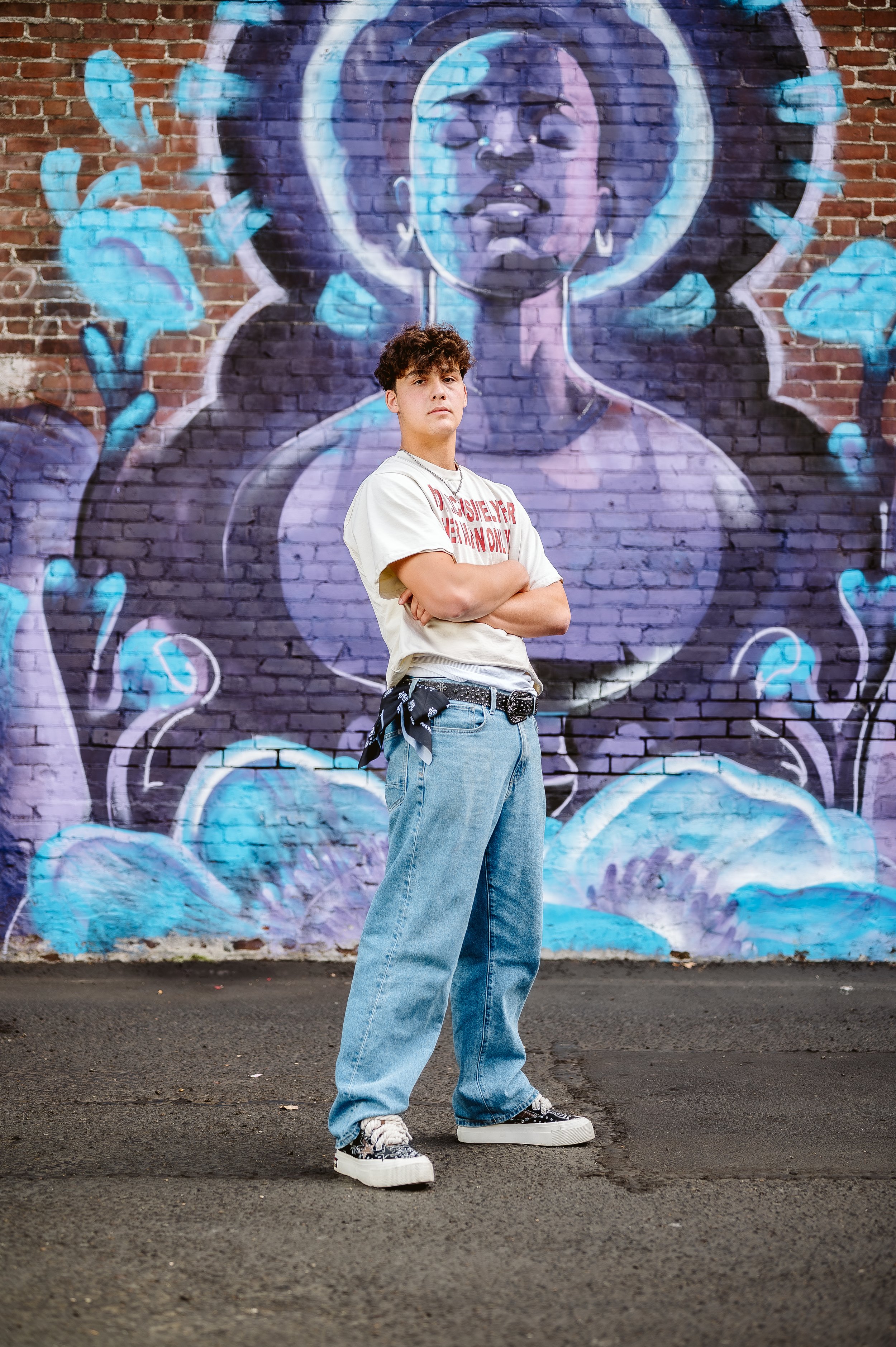 Urban senior portrait photography in Portland, Oregon featuring bold murals and confident street-style poses.