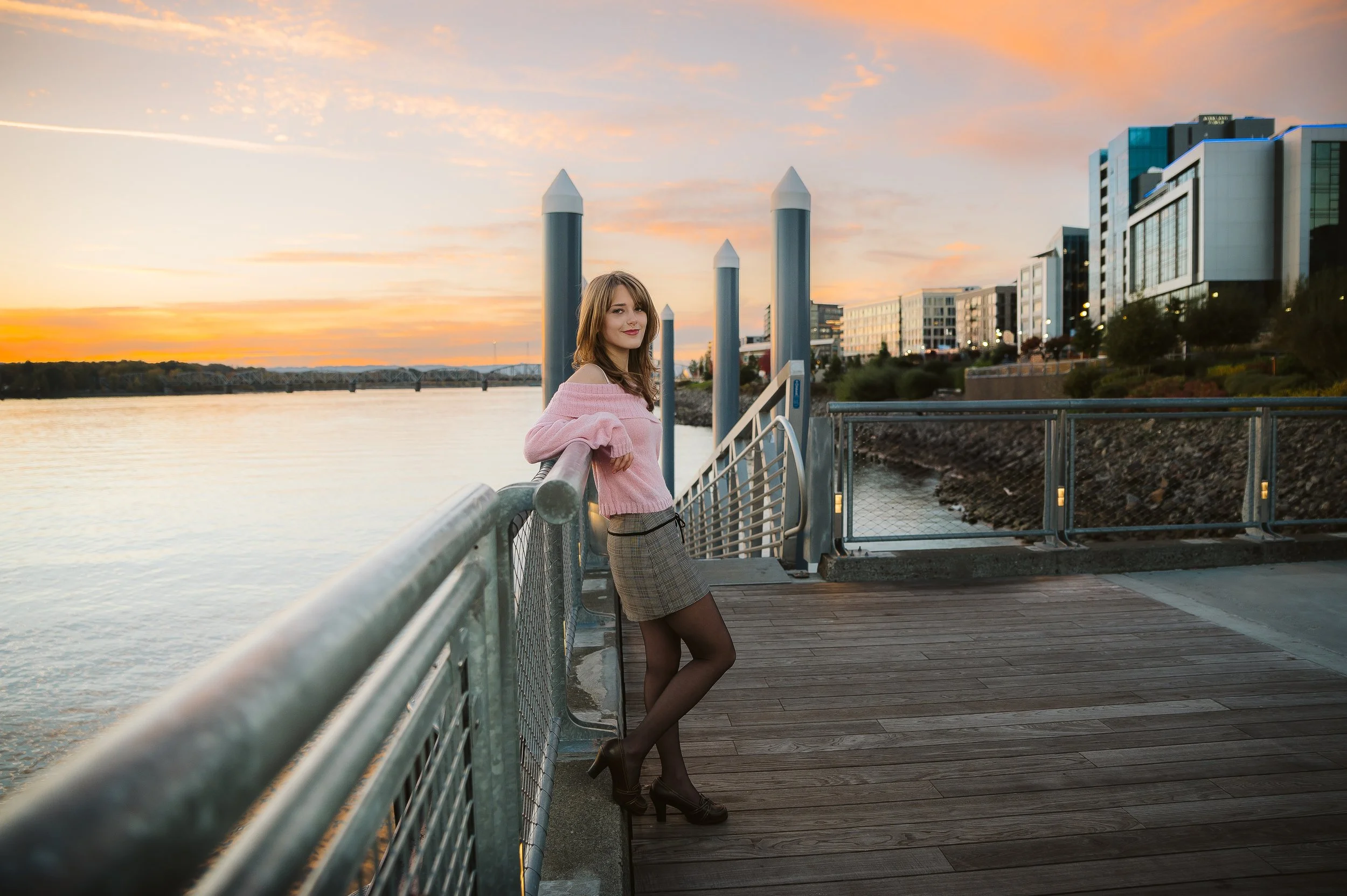 Outdoor senior photography in Vancouver Washington capturing a stylish portrait along the waterfront during golden hour.