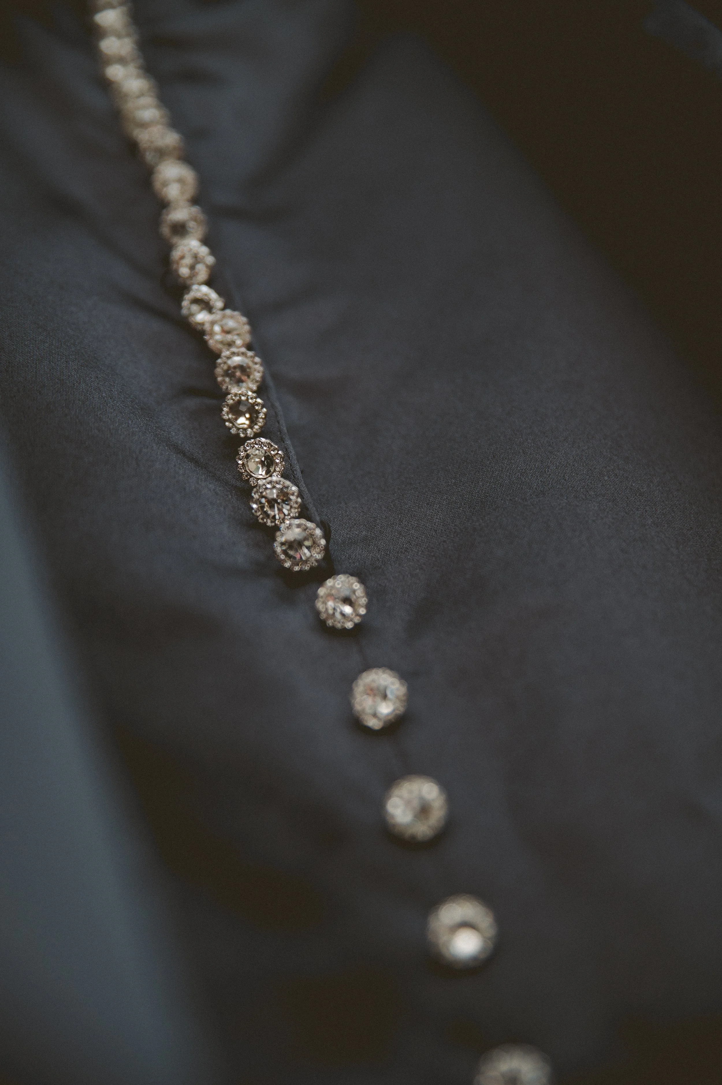 Close-up wedding dress detail for an intimate Pacific Northwest wedding.