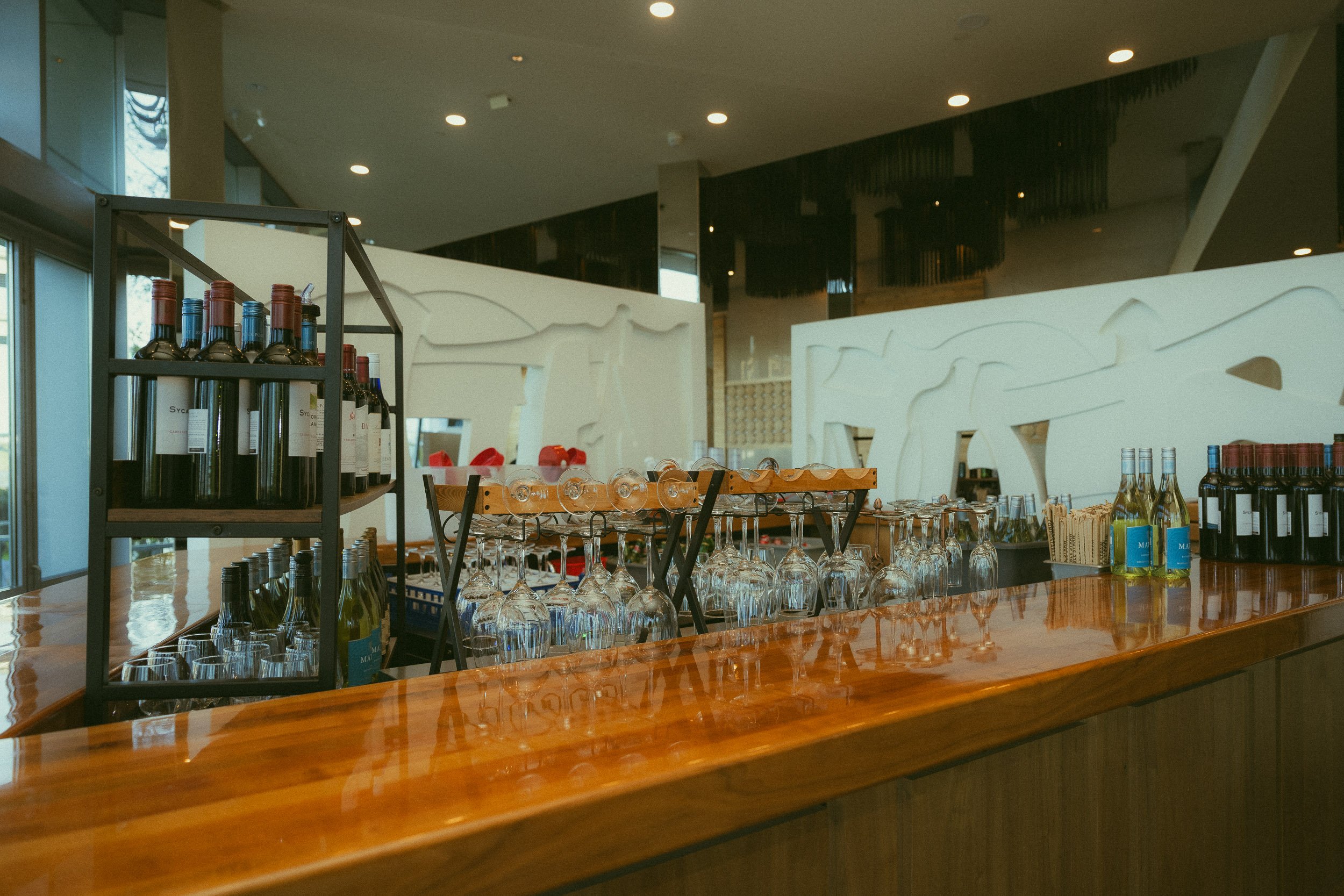 Bar area inside Dough Zone Dumpling House in downtown Portland with modern design, warm lighting, and elegant cocktail space for rehearsal dinner gatherings