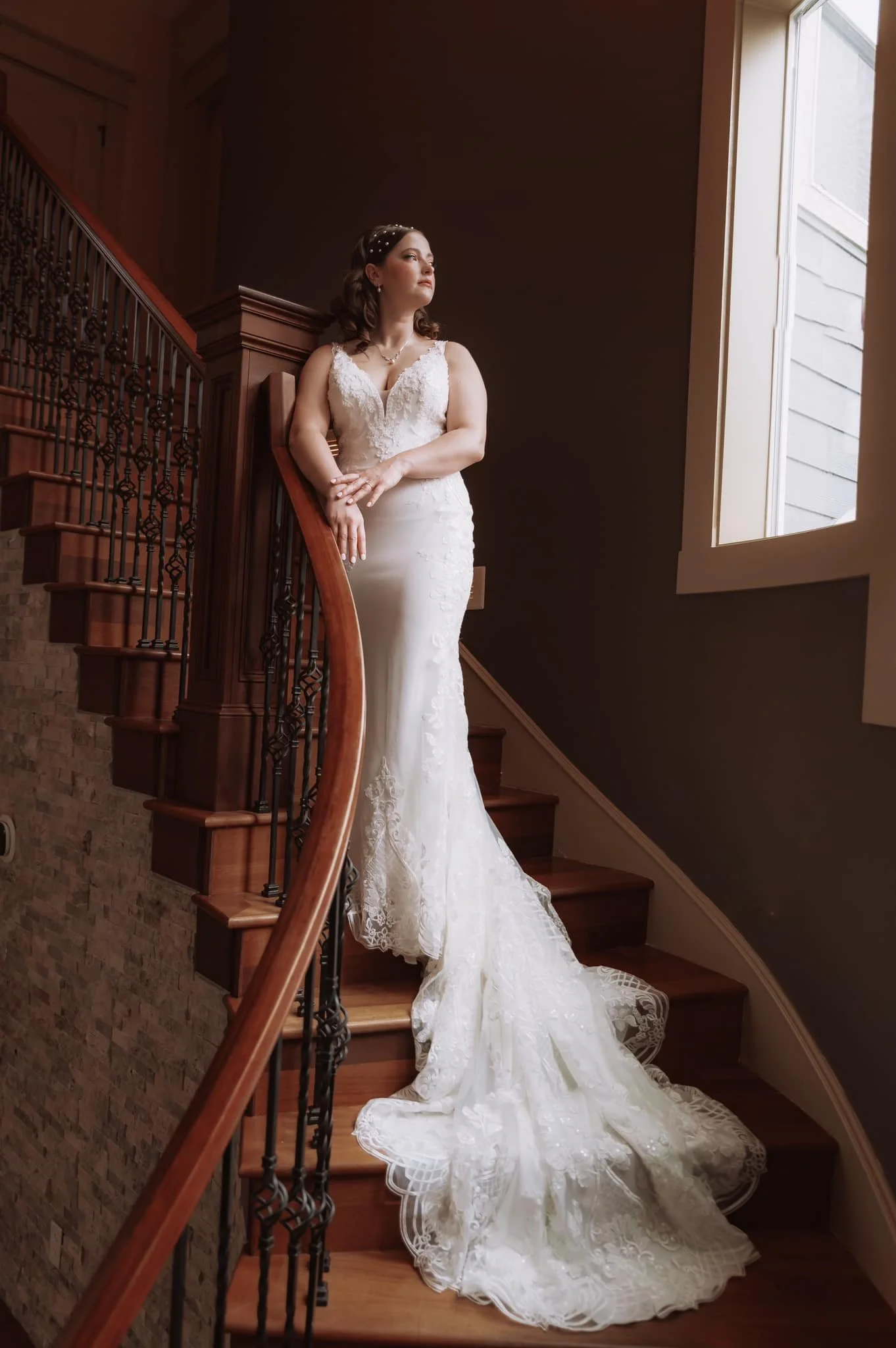 Bride standing on a staircase during a New Year’s Eve elopement in the Pacific Northwest