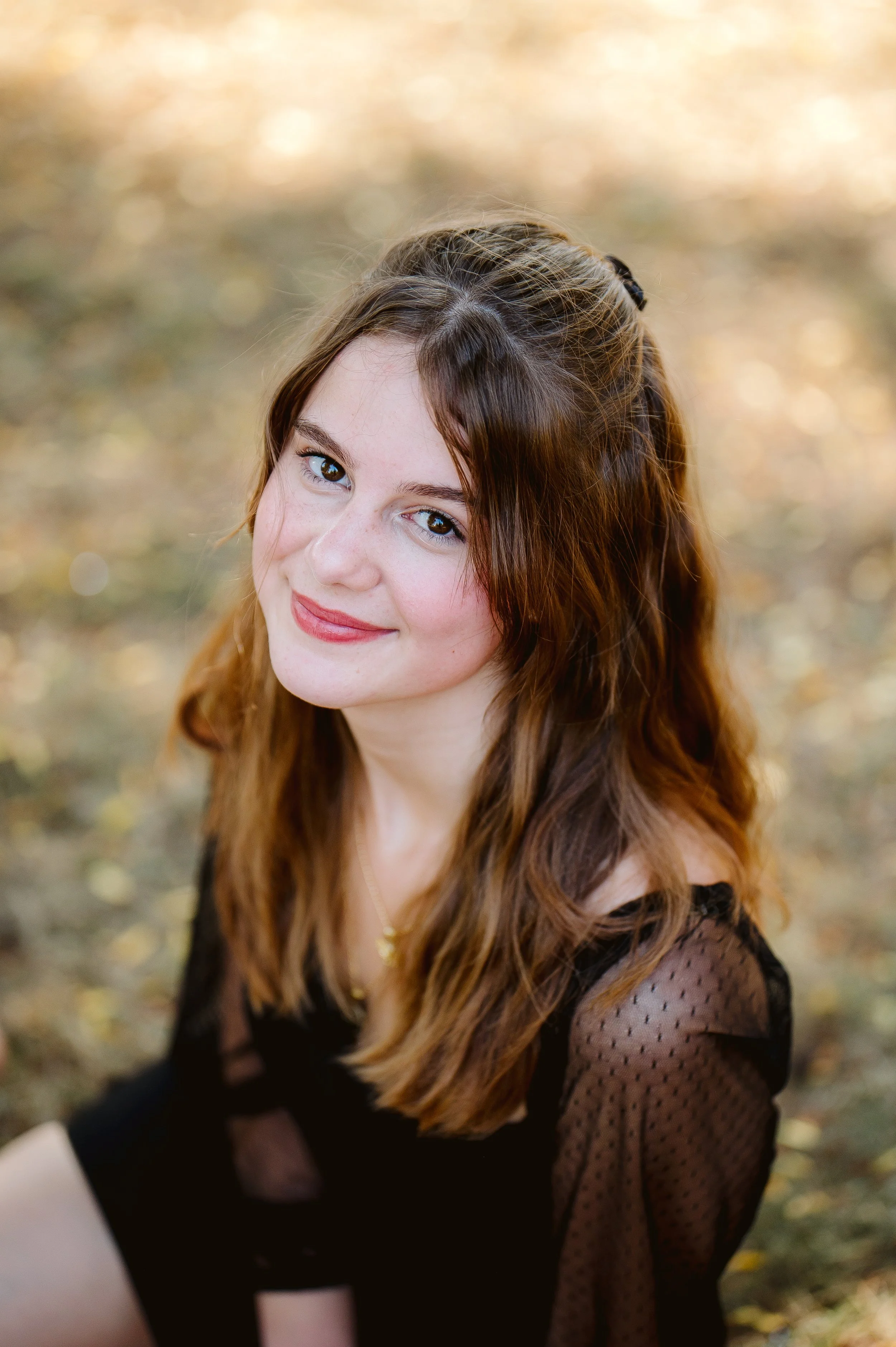 Senior photography portrait taken in Vancouver Washington with a relaxed close-up composition and softly blurred background.