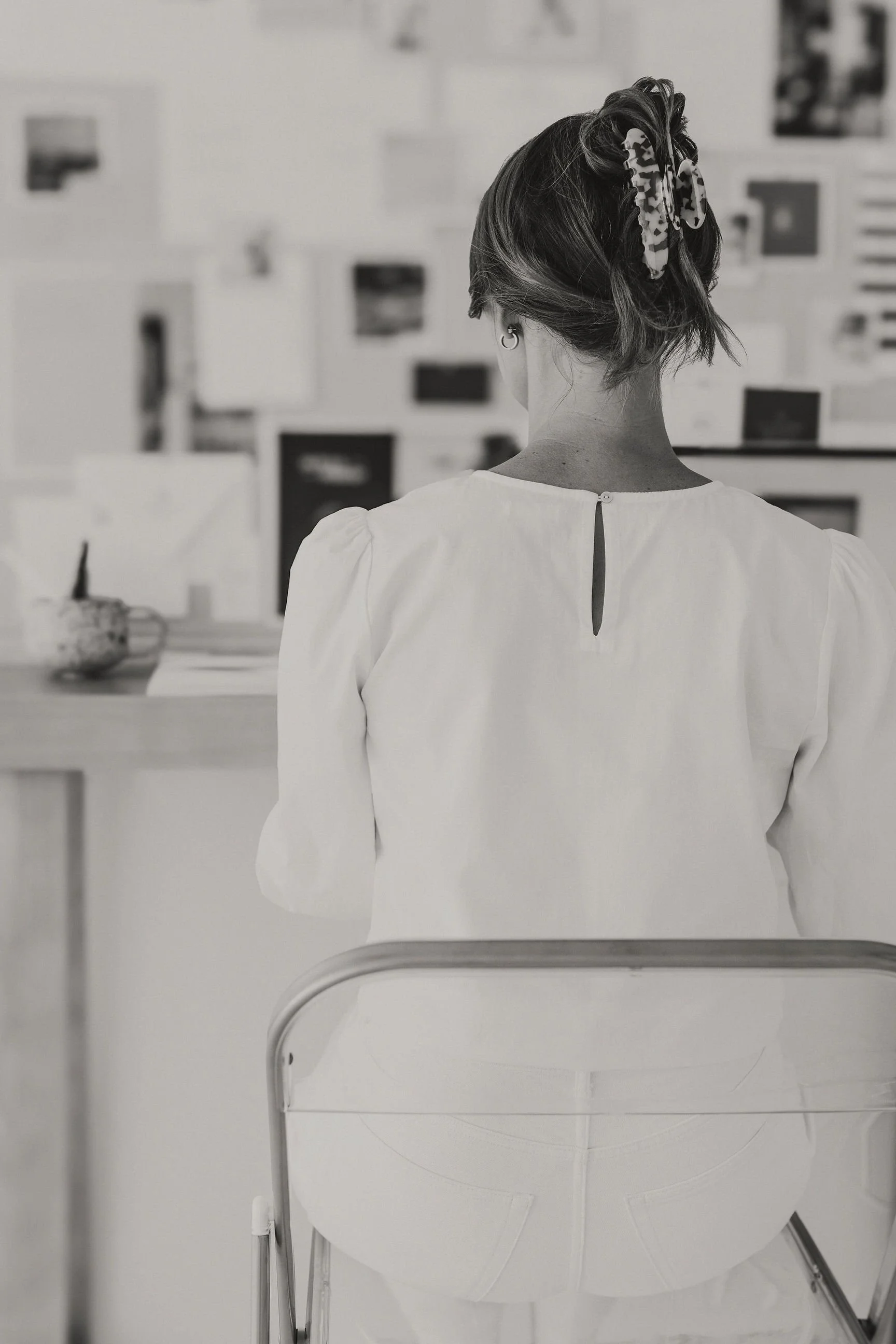 luxury brand designer sitting at desk