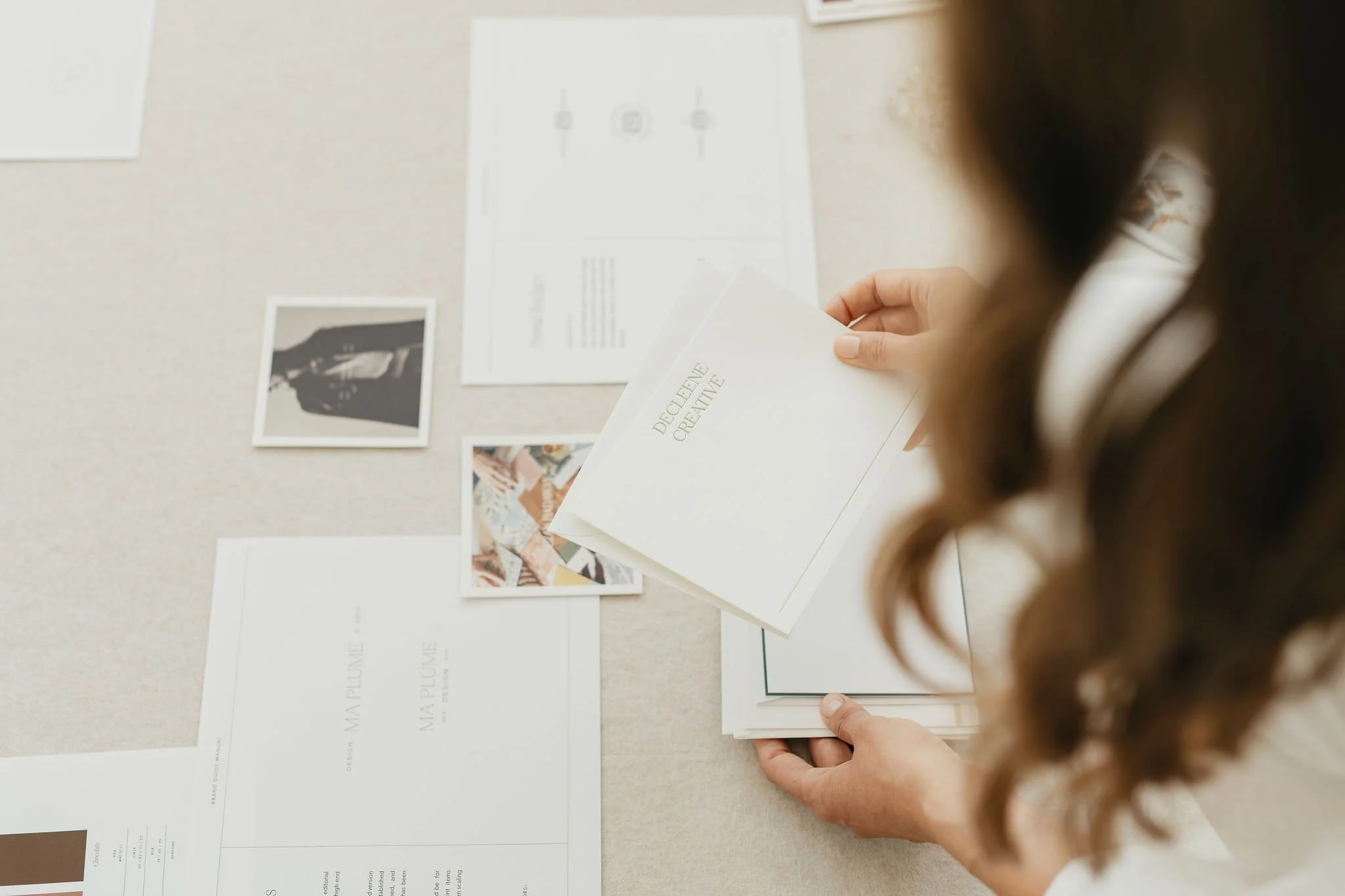 female creative founder setting out brand design examples