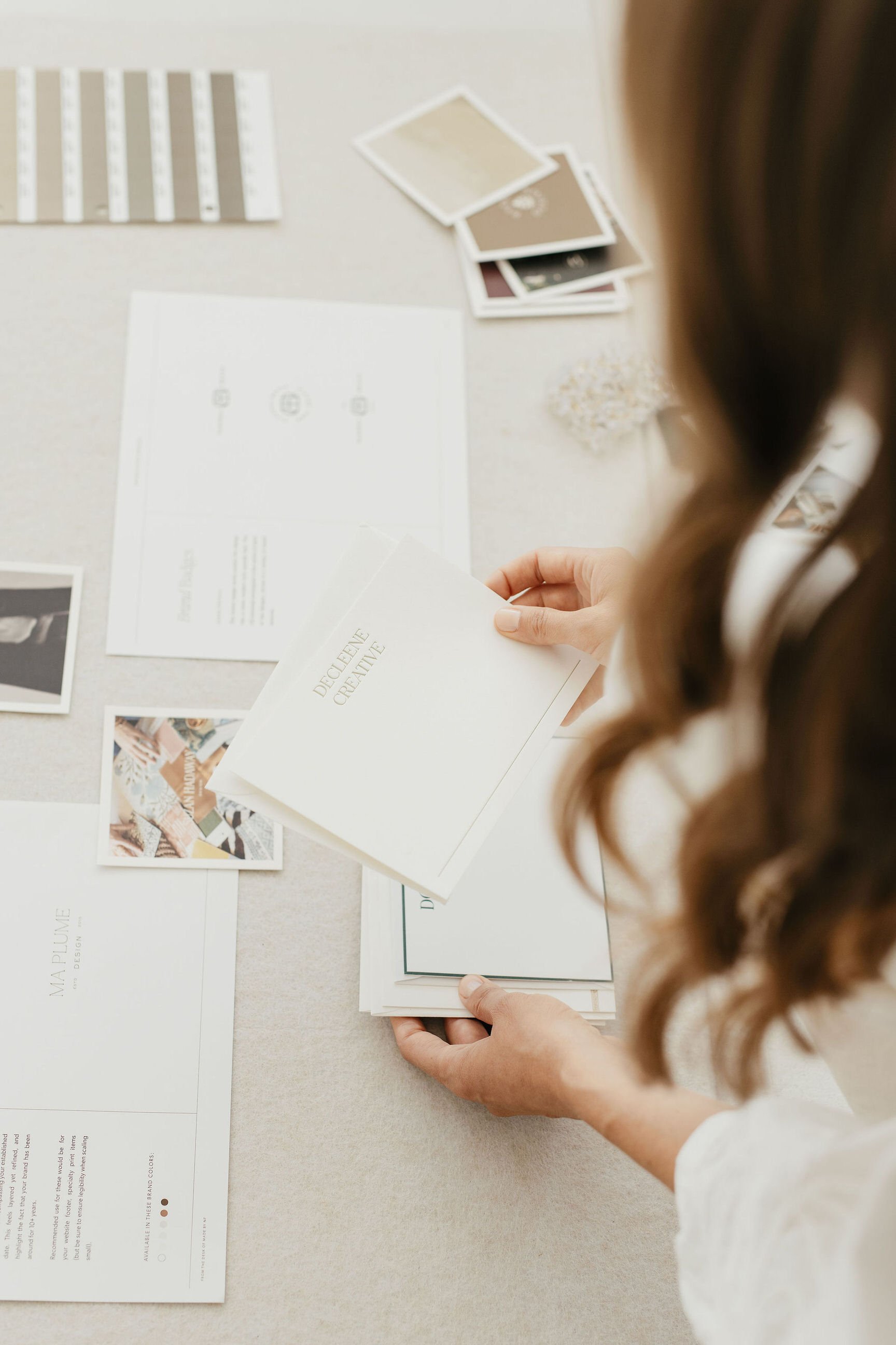 female creative founder working on brand presentation for interior designer