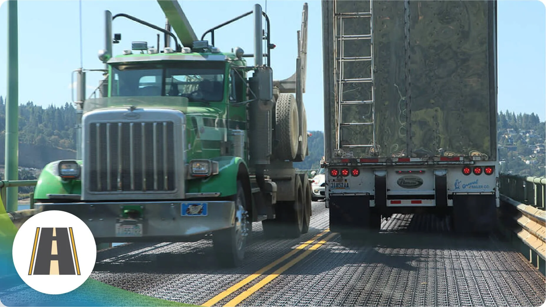 Two large vehicles driving on the current Hood River-White Salmon Bridge. The road is narrow and the vehicles are extremely close to each other.