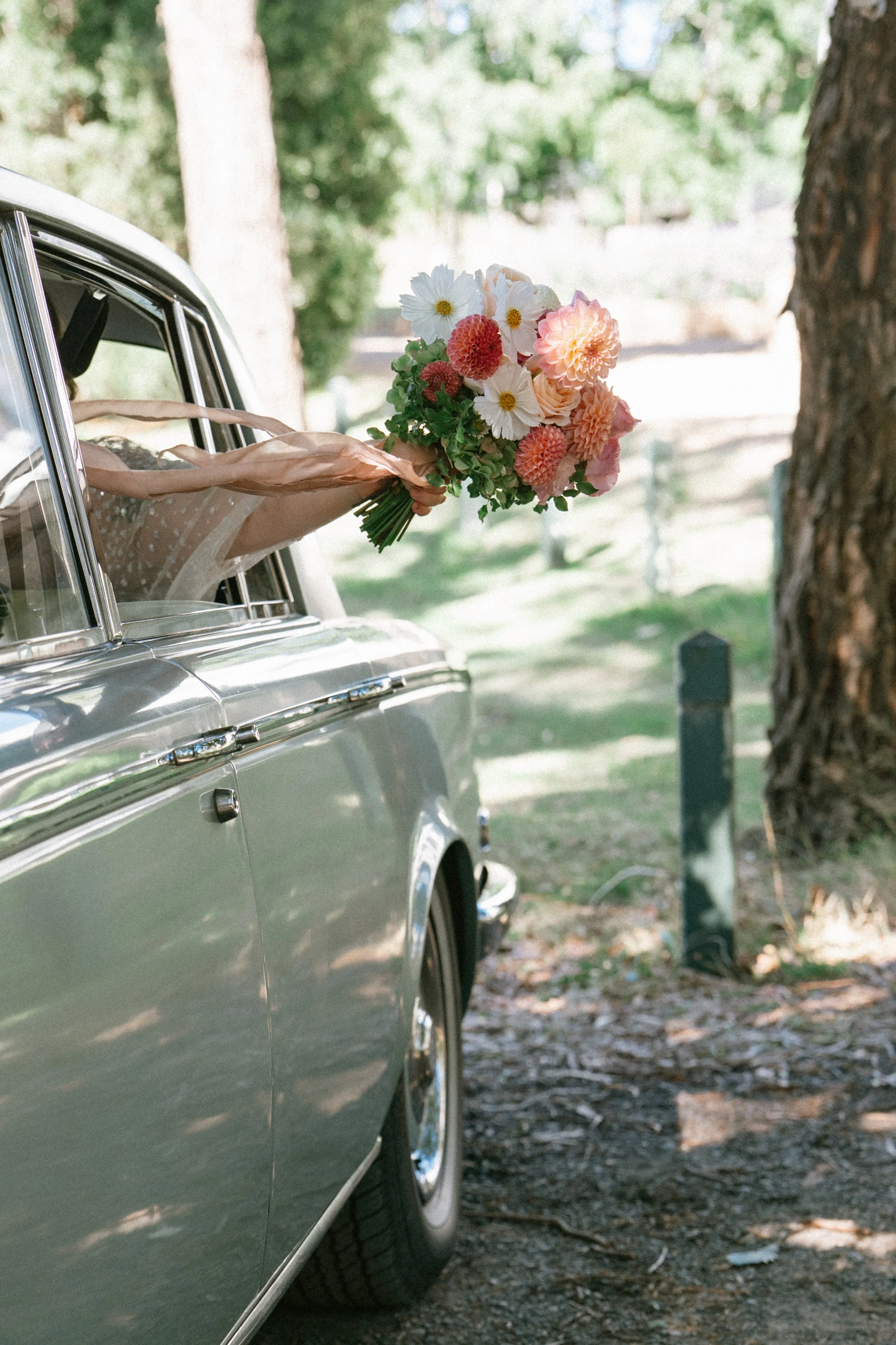 Wedding car and bouquet photo by Heartlands Studio.  Silver Mink Tours vintage Rolls Royce.  Ballarat-Daylesford VIC