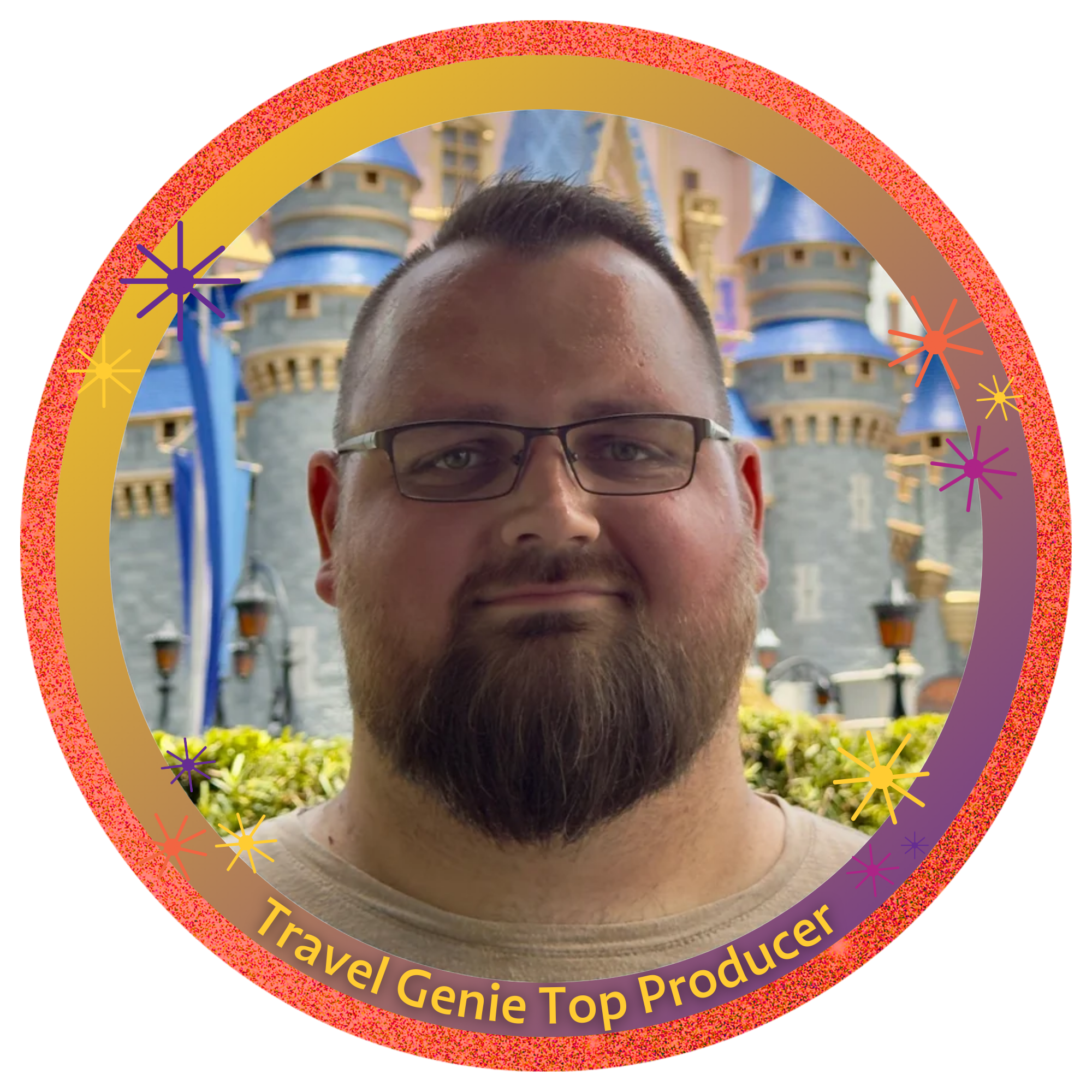 A man with glasses and a beard standing in front of a castle with blue turrets, yellow accents, and Disney-themed architecture.