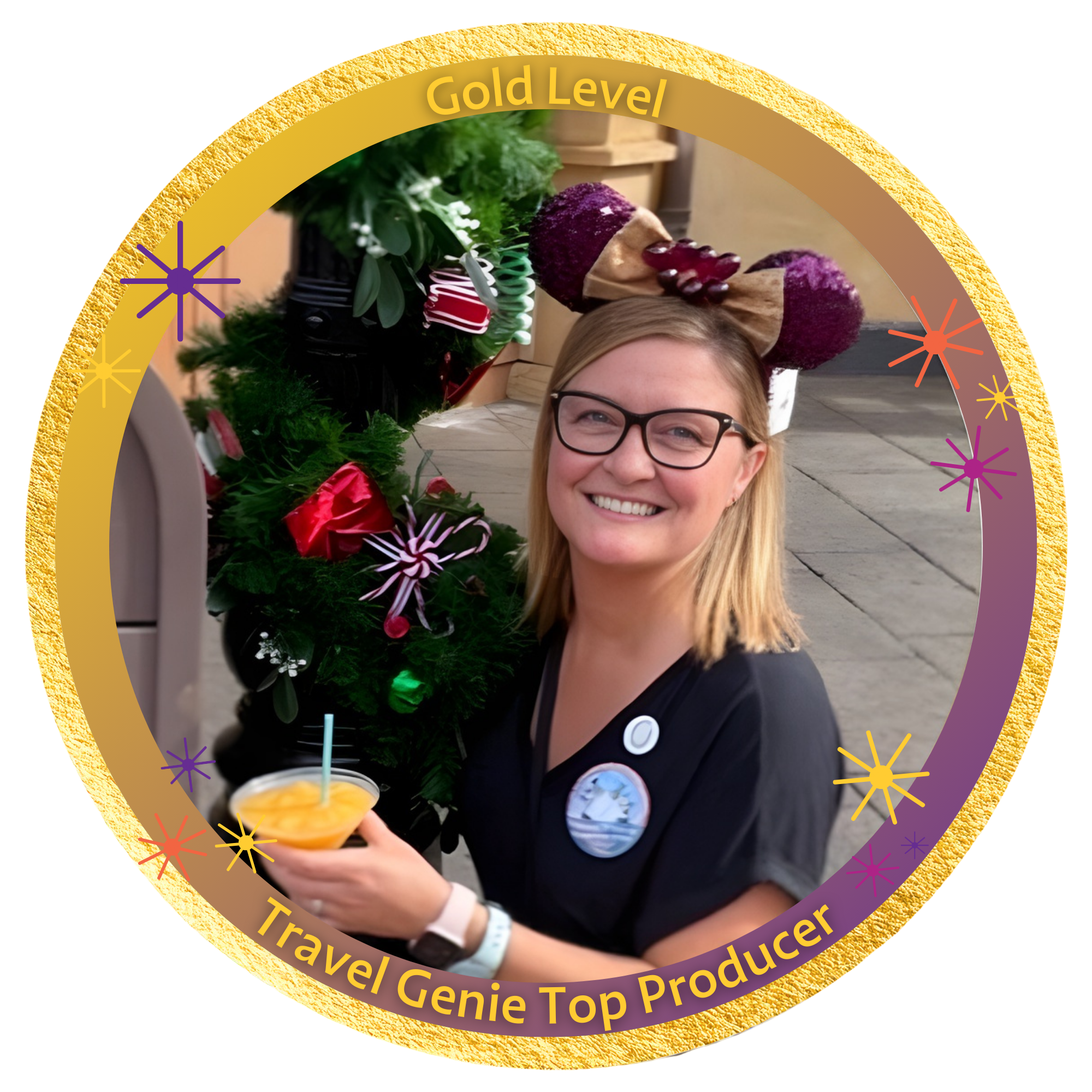 A smiling woman wearing glasses and holiday-themed headband, holding a drink, standing next to Christmas decorations, with a badge on her shirt reading "Travel Genie Top Producer."