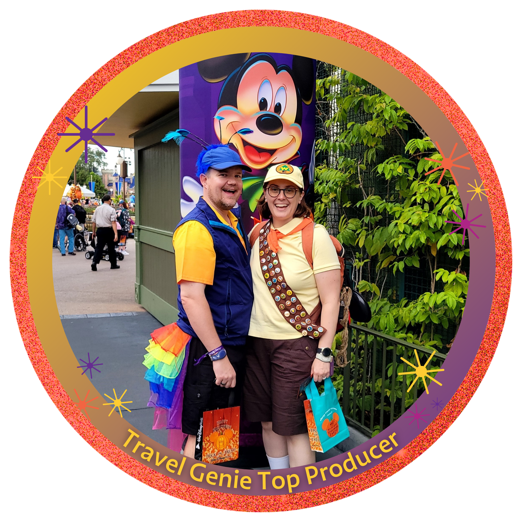 Photo of two people at Disney park, standing in front of a large Mickey Mouse poster with the words 'Enjoy the Party.' They are smiling, wearing colorful outfits and hats, and holding Disney-themed gift bags. The photo is framed with a pink and purple circle and the words 'Travel Genie Top Producer' at the bottom.