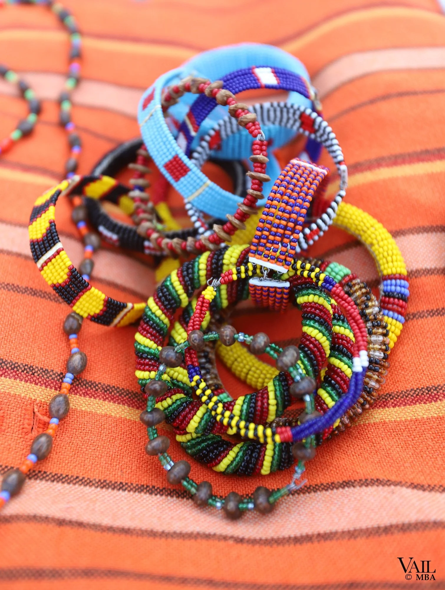 Colorful beaded jewelry, including necklaces and bracelets crafted by a native woman in the Maasa Mara.