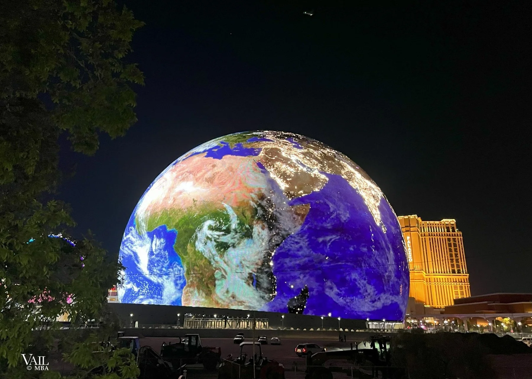 The Las Vegas Sphere with a world graphic wrapped around the globe.