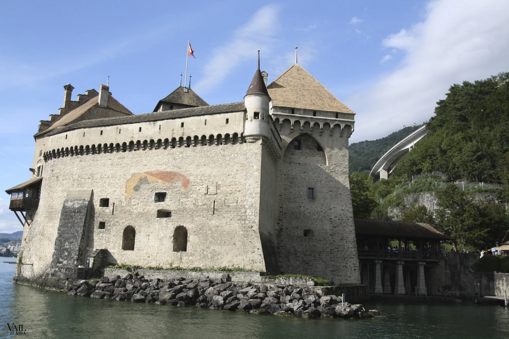 The historic stone Chillon Castle in Switzerland on the river.