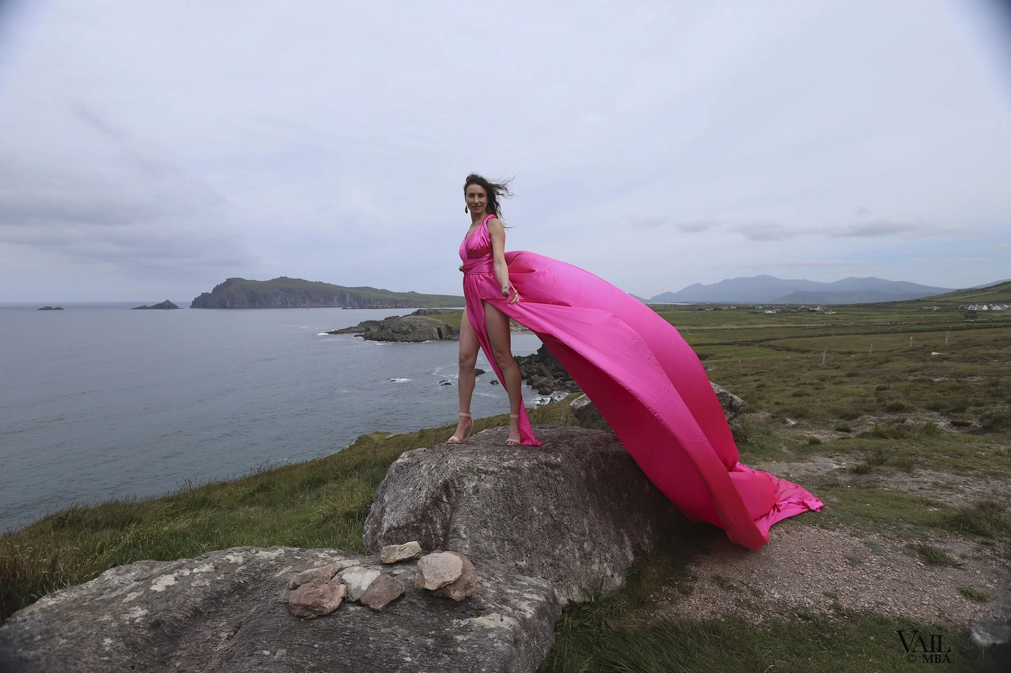 Pink flying dress photo on the cliffs in Ireland. 