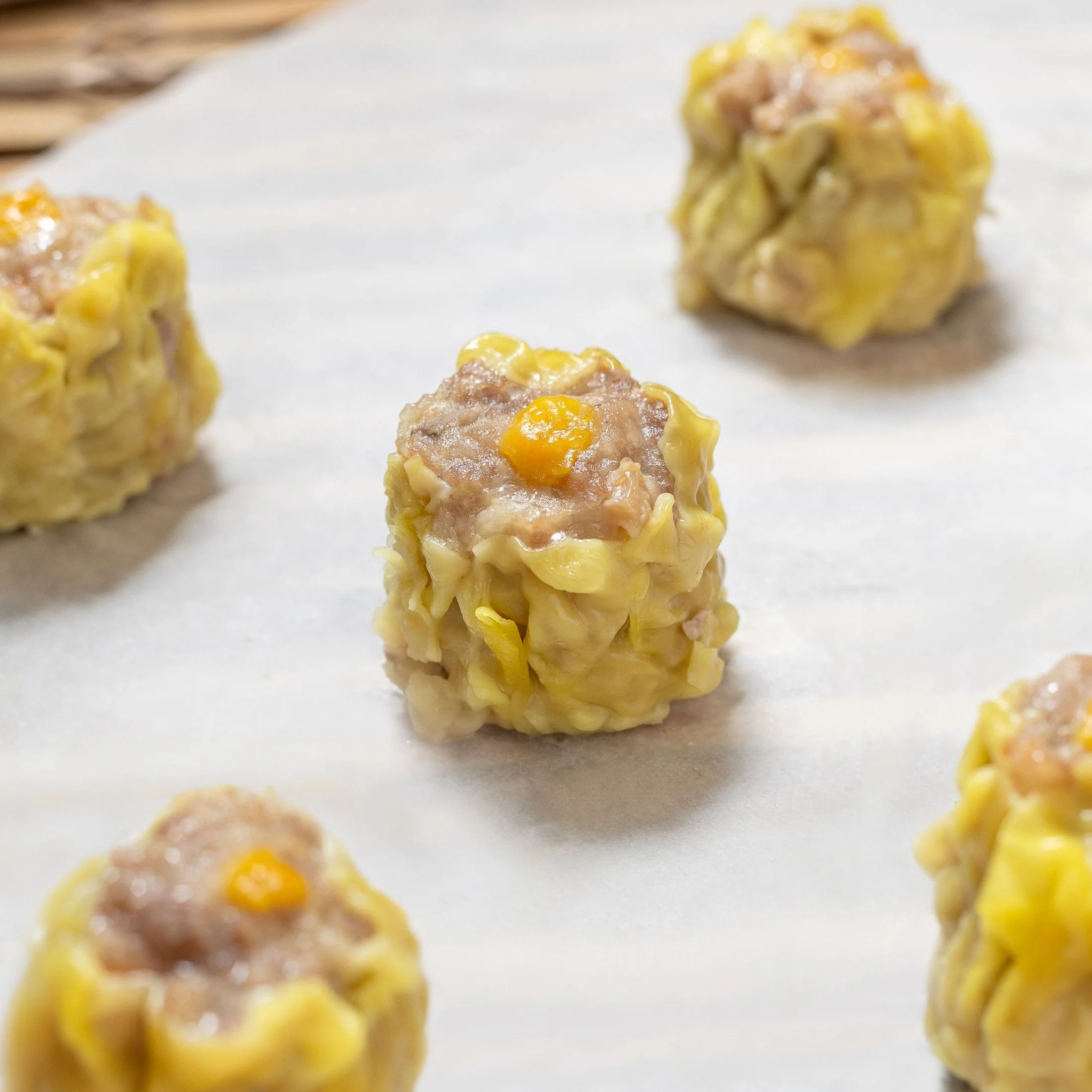 Best Chinese siu mai in Seattle and Bellevue, filled with tender pork, succulent shrimp, and earthy mushrooms, handcrafted and steamed fresh at our dim sum restaurant.