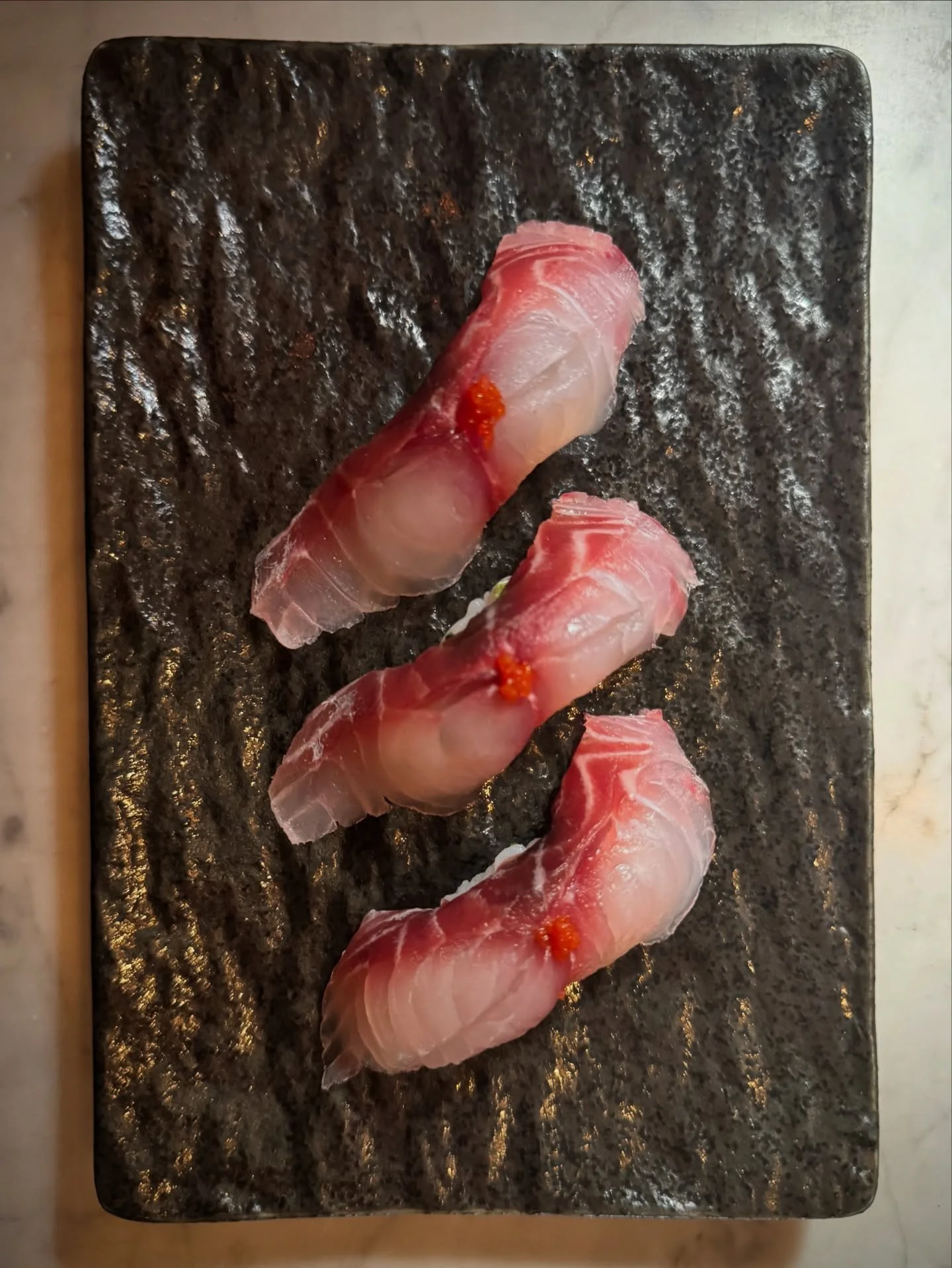 Highlighting the gorgeous Isaki, Grunt fish, topped with red yuzukosho! 🩷❤️🍣 Reserve your next dinner at the link in bio :) 

#sushi #isaki #nigiri #foodie #venturablvd