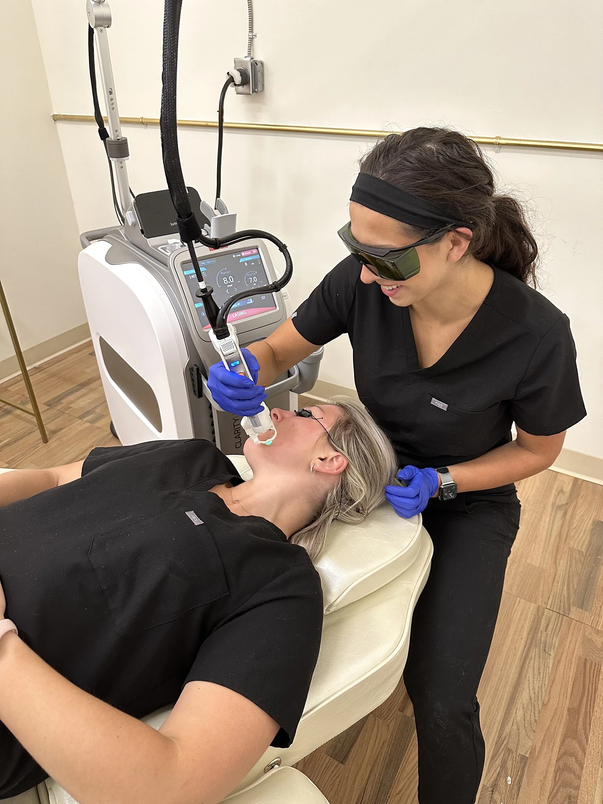 Client receiving a laser facial treatment at Golden Aesthetics in Newtown, CT for skin rejuvenation before her wedding
