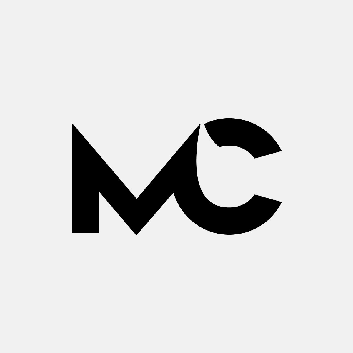 Mediumcast logo. Large M and C. Coloured black on a grey background