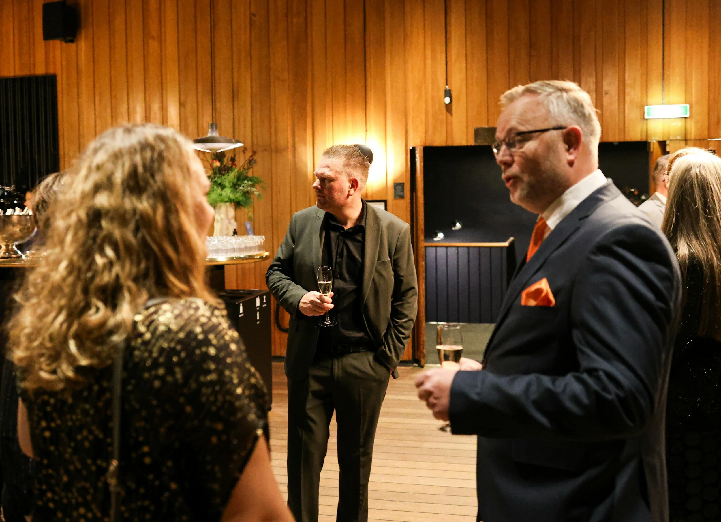 Business owner confidently introducing their business at a networking event