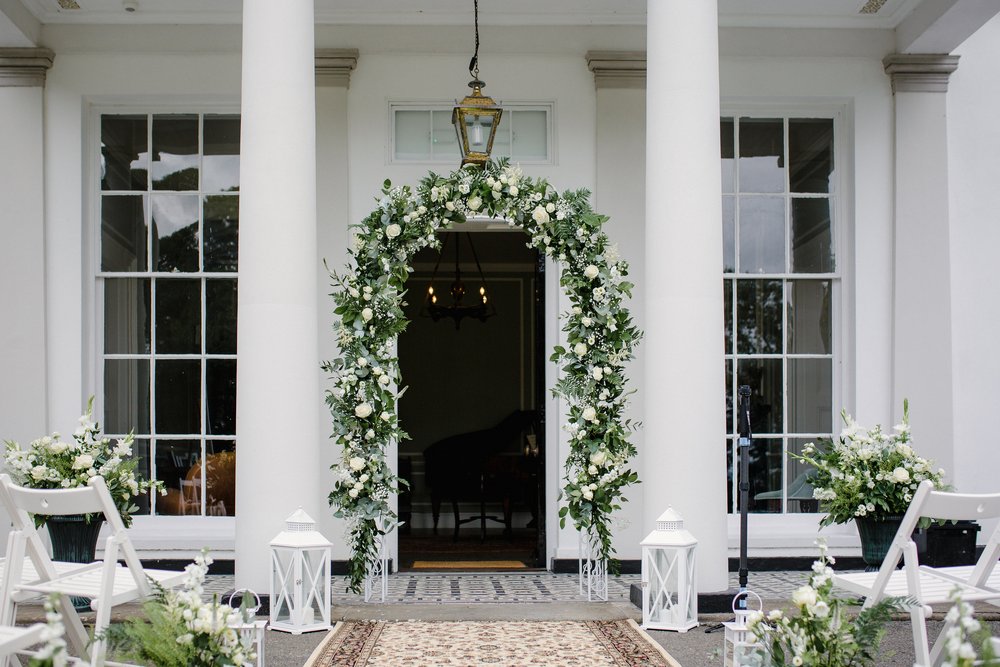 The portico entrance at North Devon wedding venue Moreton House, set up for a wedding ceremony.