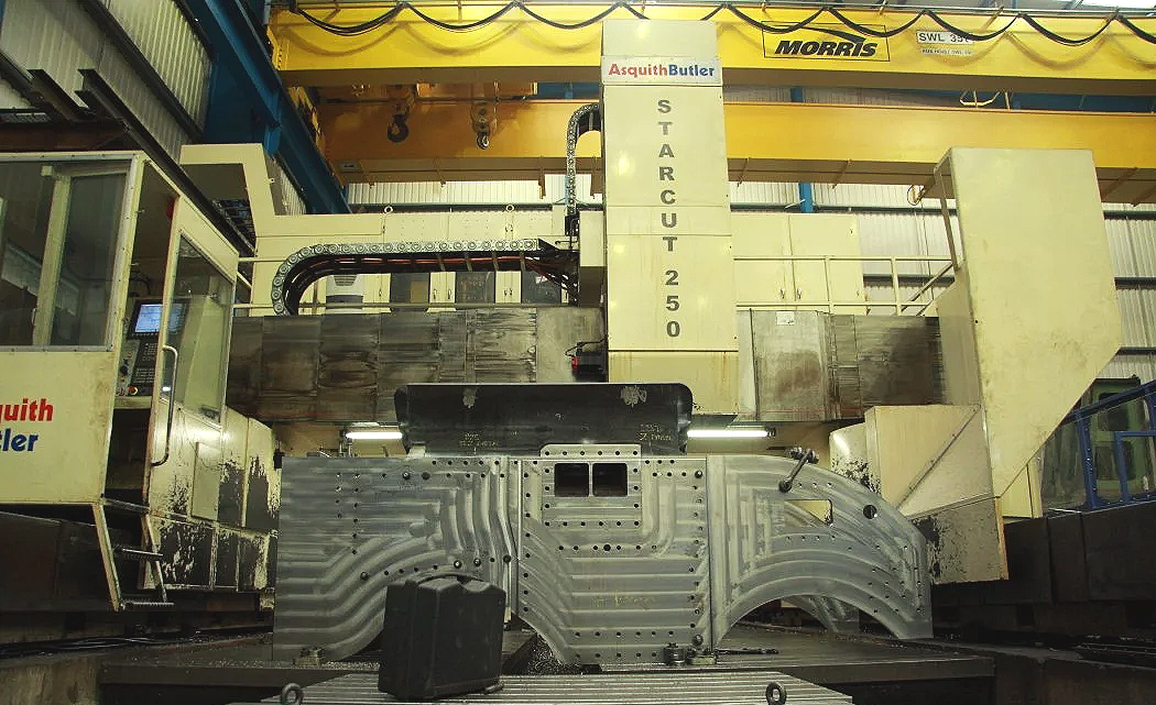 Large industrial CNC machine labeled 'StarCut 250' in a manufacturing facility.
