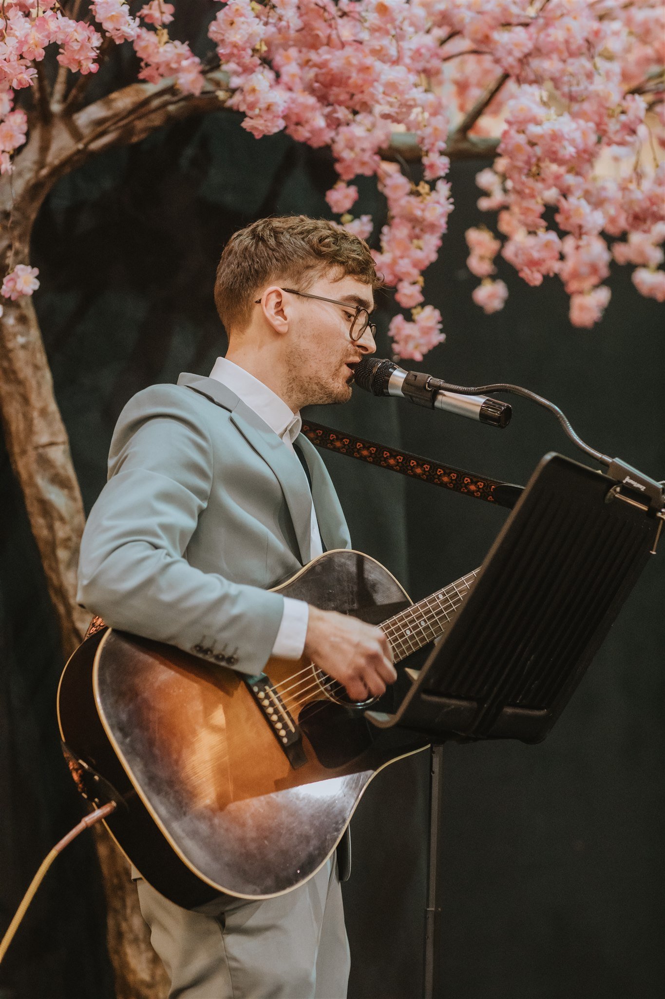 Leigh Coleman performing at The Big Southwest Wedding Fair - musician on stage