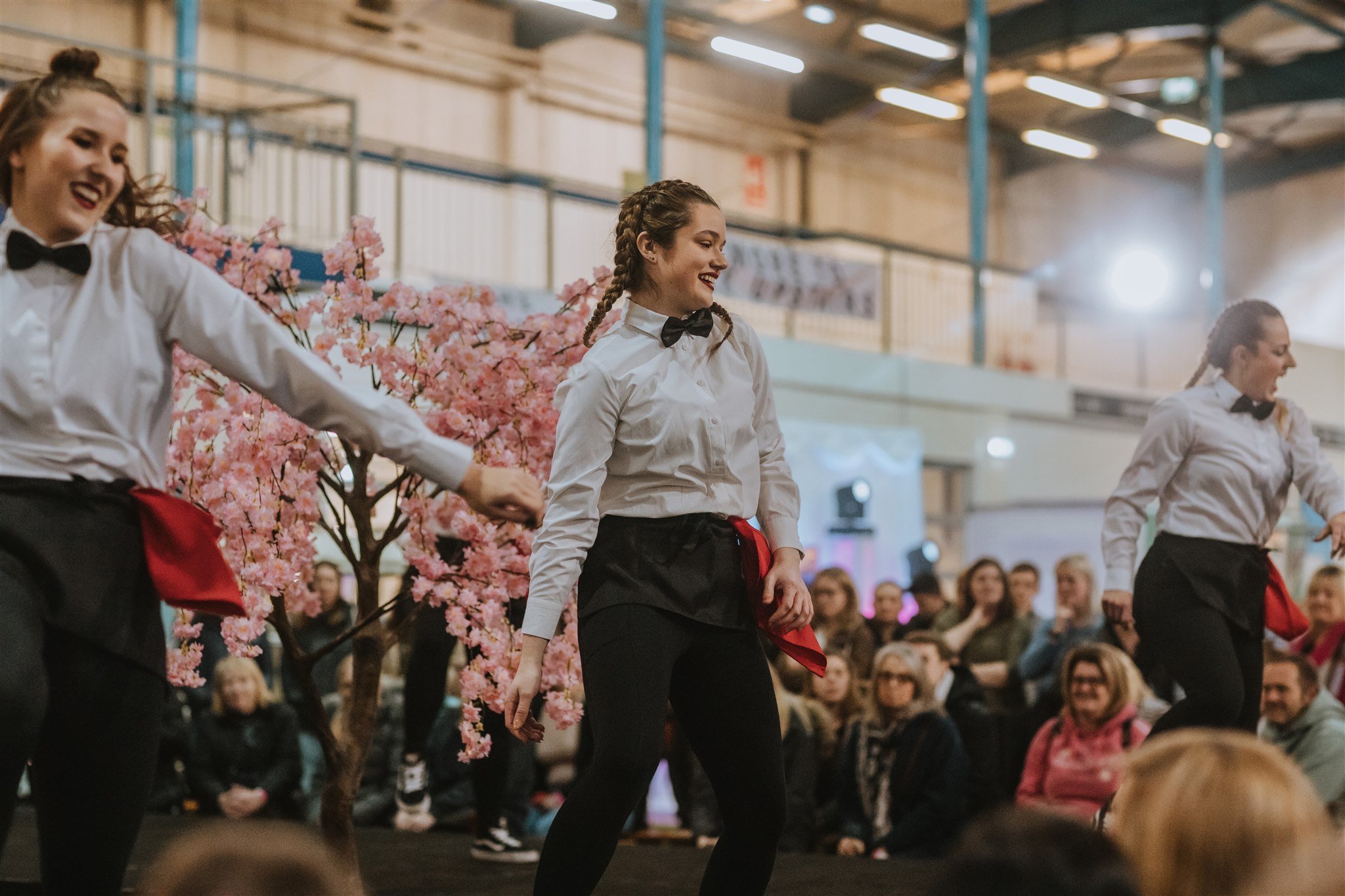 The Dancing waiters with a surprise performance on stage before the catwalk begins at The Big Southwest Wedding Fair on the 1st-2nd April 2023 at The Royal Bath &amp; West Showground.