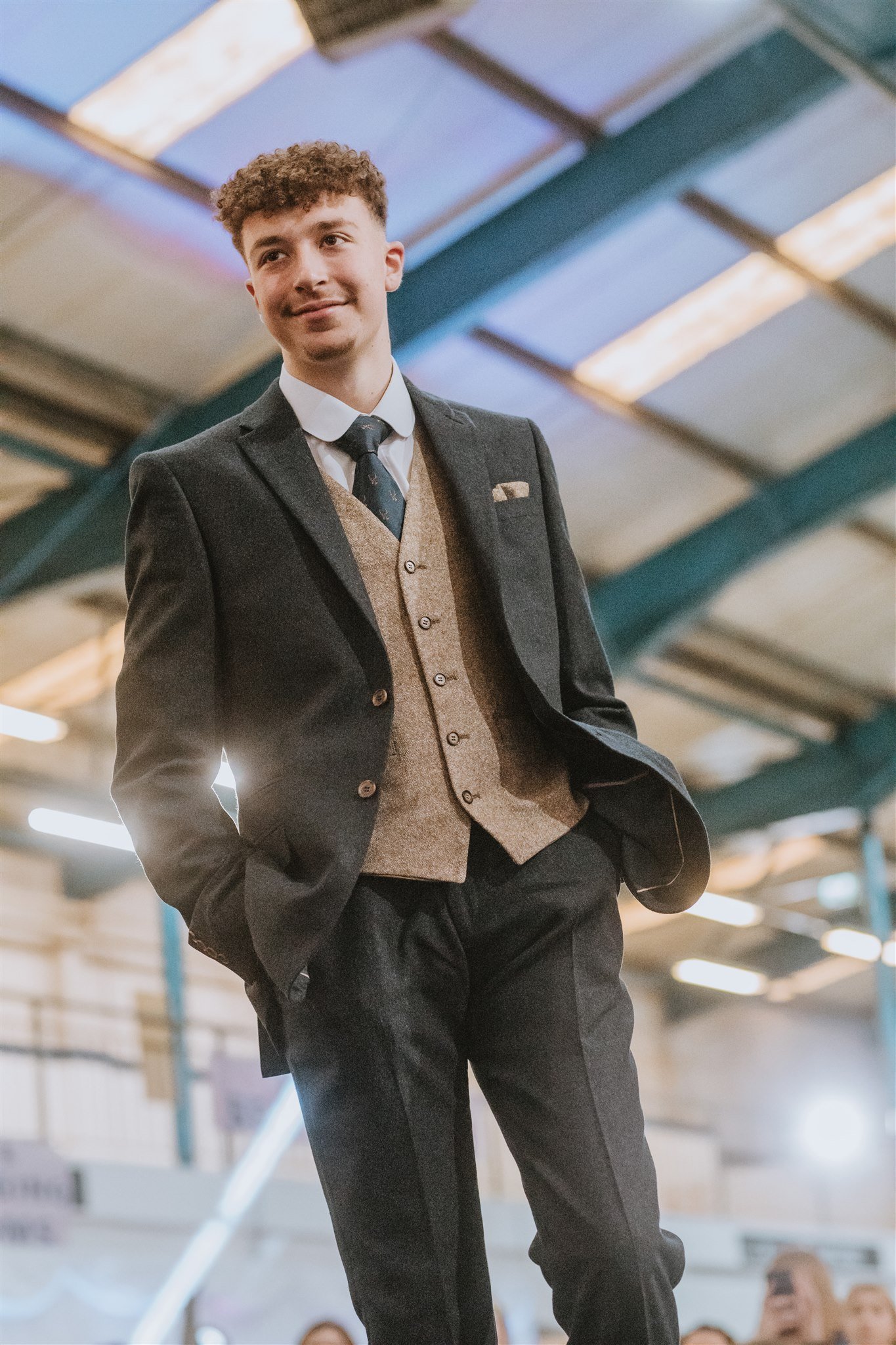 Male model on the catwalk showcasing mens wedding suithire at The Big Southwest Wedding Fair