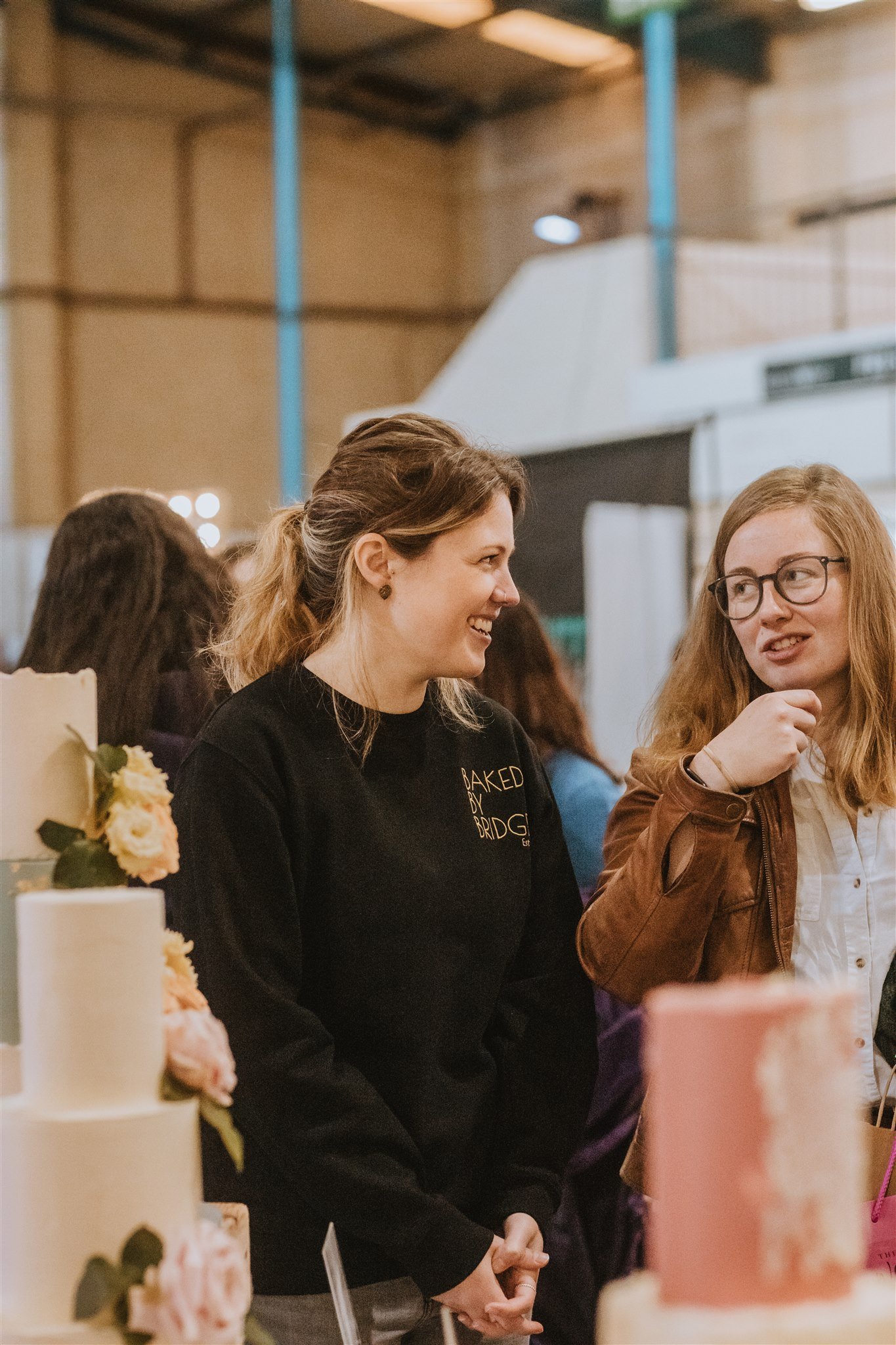 Chatting exhibitor and wedding business owner Baked BY Bridget at The Big Southwest Wedding Fair