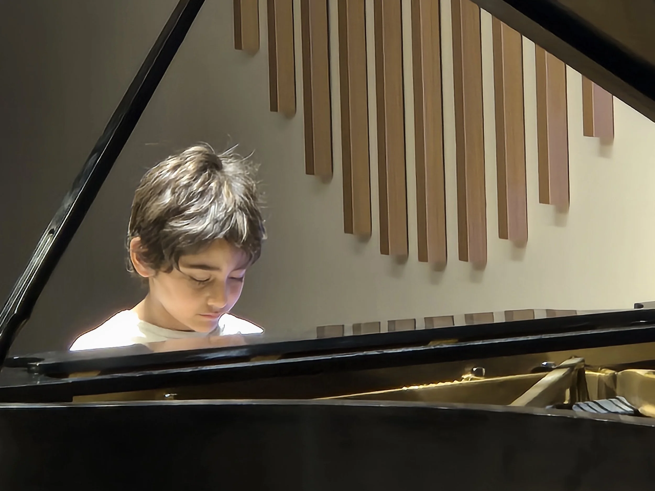 Ario Playing Piano at Theme Recital