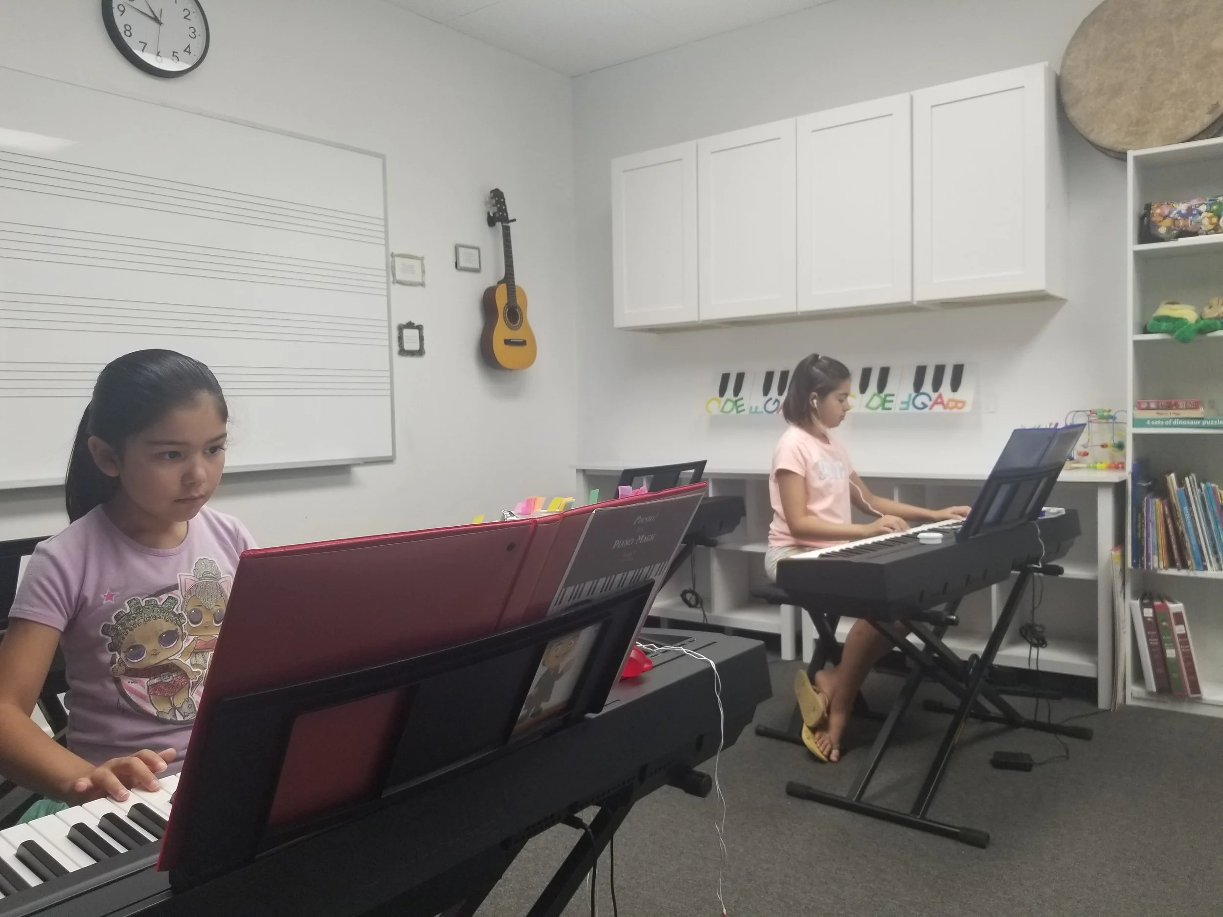Piano Students in Music Classroom