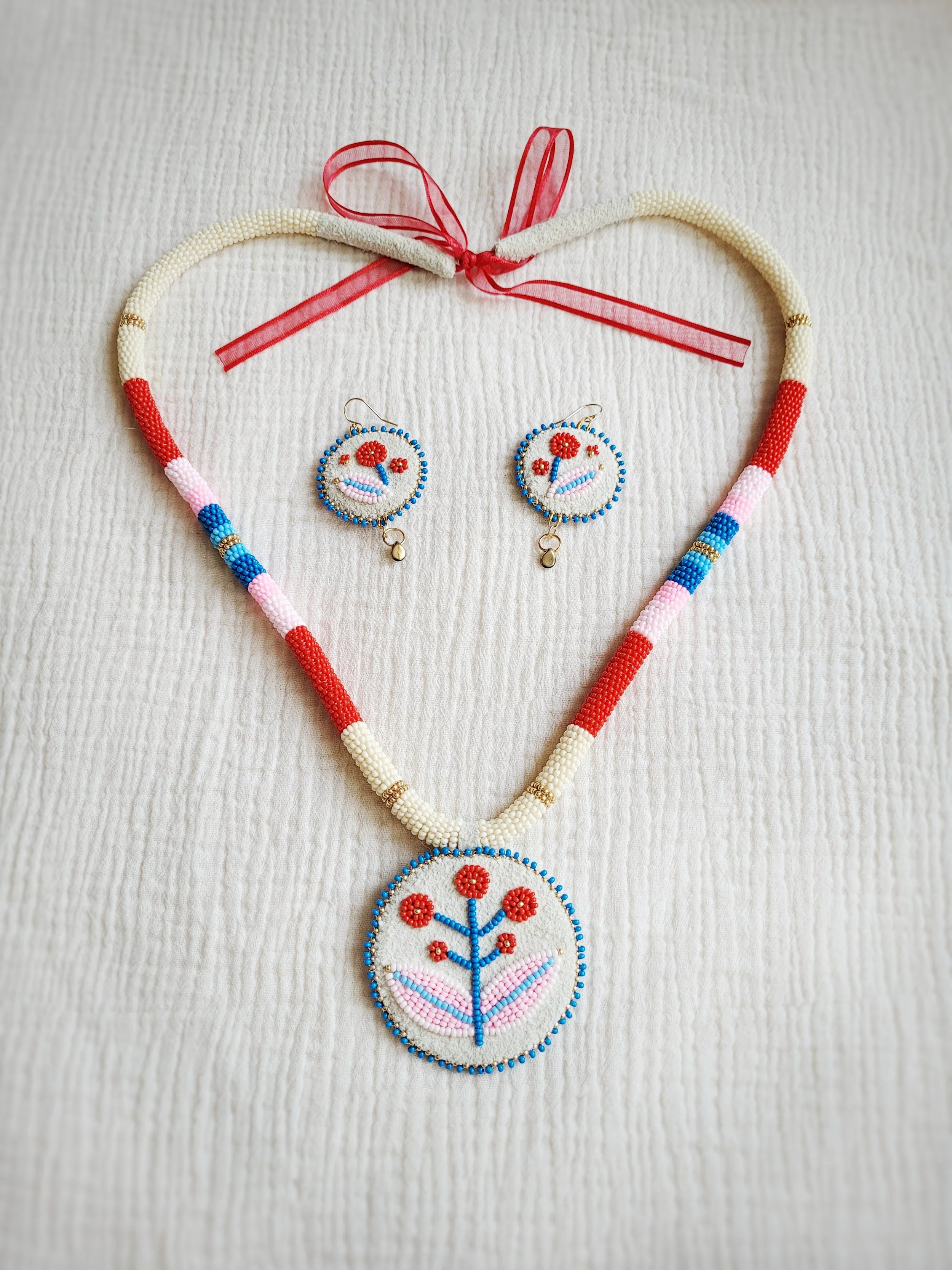 "Colour Pop" moose hide necklace and earring set. Stephanie Chambers // 2023