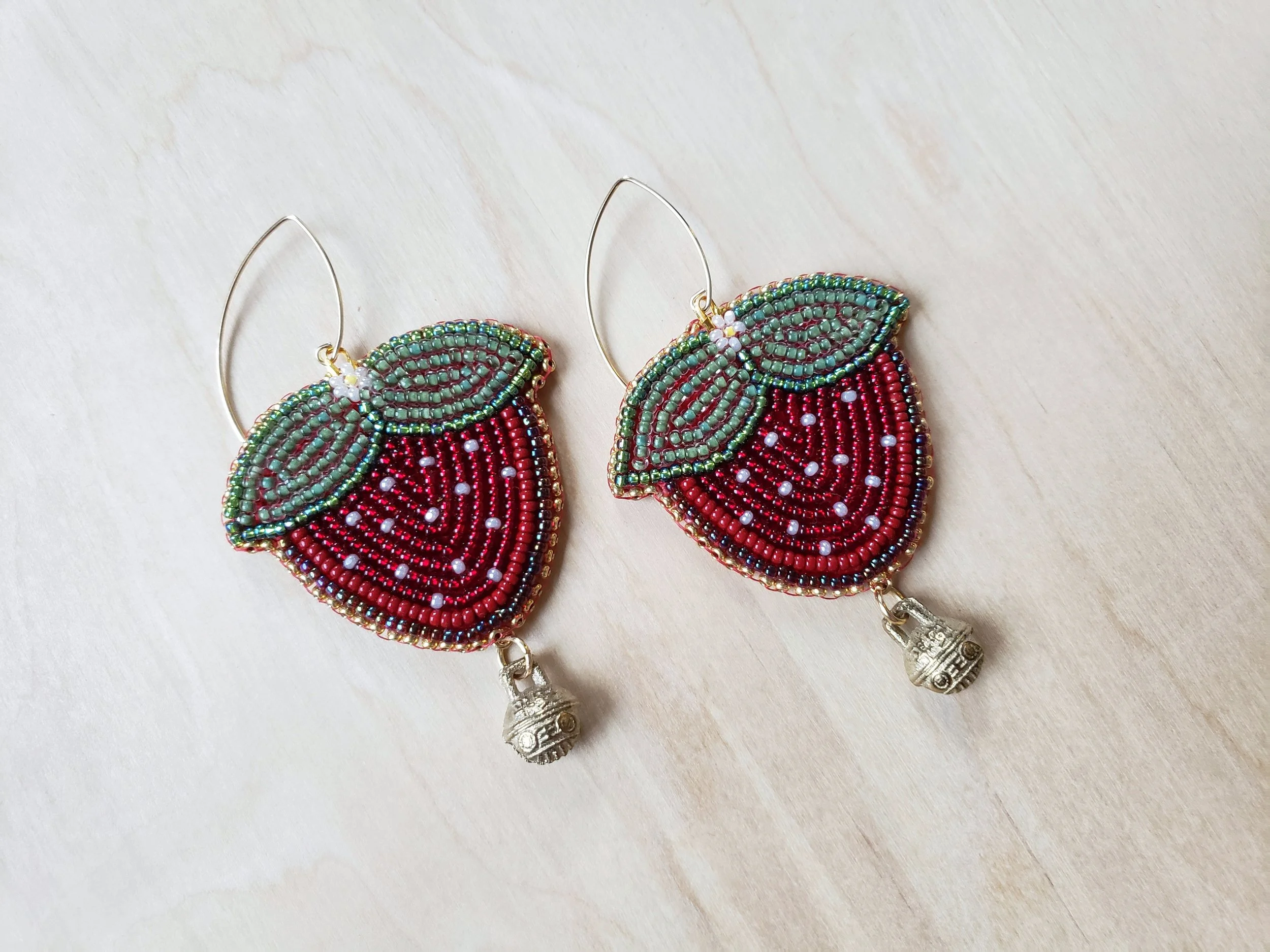 Stephanie Chambers // 2022 //

Glass beads, backed with Manitoba sourced moose hide and finished with 18k gold filled ear wires, and brass bells.