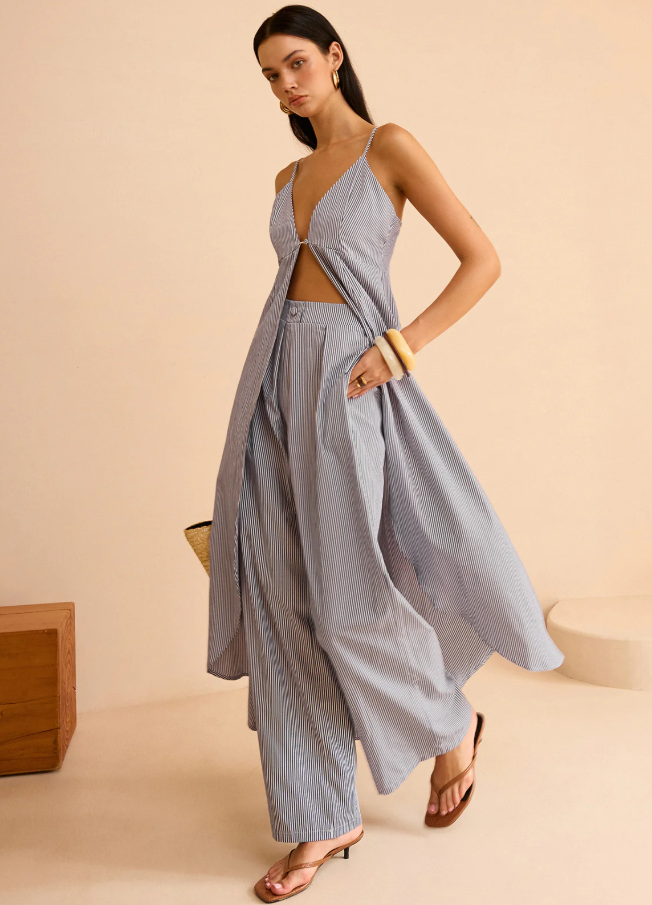 Model wearing striped long cami and wide leg pant set from The Commense