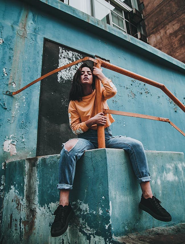 Man in black long sleeve shirt and black pants sitting on concrete stairs  photo – Free Lahore Image on Unsplash