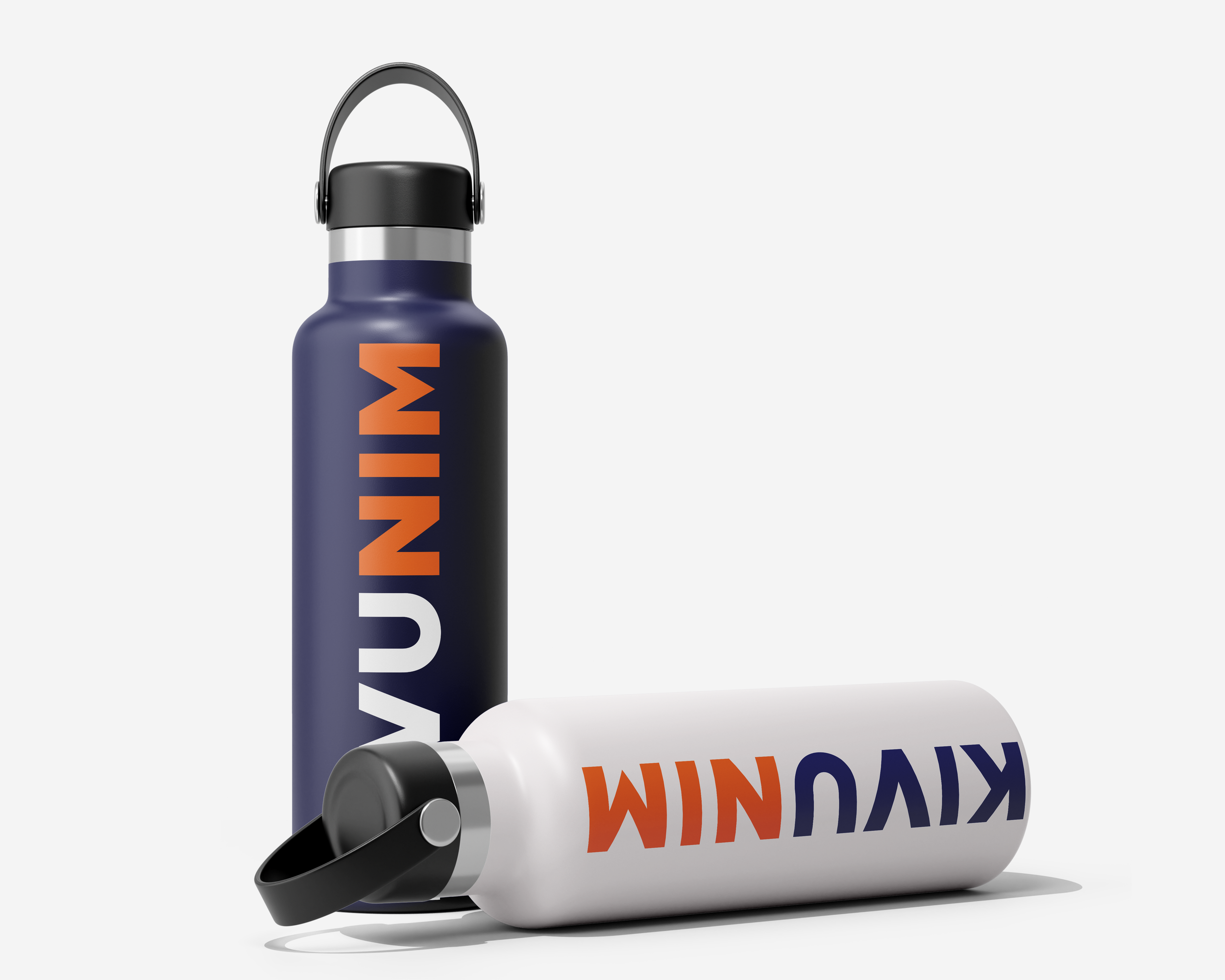 Two reusable water bottles with the name 'KUMM' written on them, one standing upright and the other lying down.