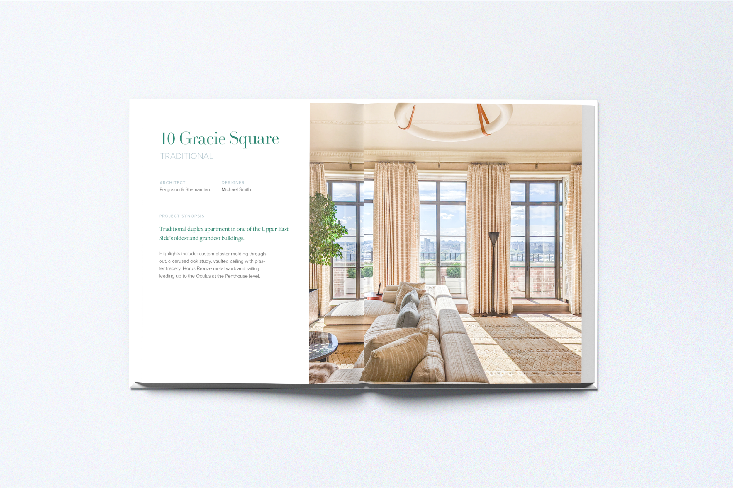 Open magazine with interior design article about 10 Gracie Square apartment, featuring a photo of a living room with large windows, beige curtains, a beige sectional sofa with cushions, a black floor lamp, and a potted plant.