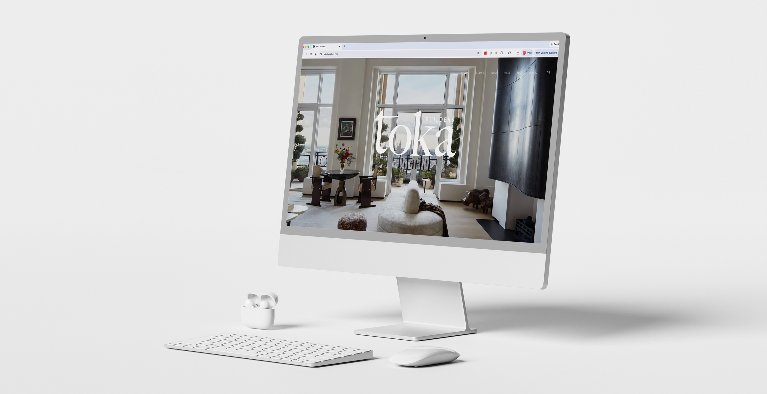 Computer monitor displaying a modern living room with large windows, a fireplace, and furniture.