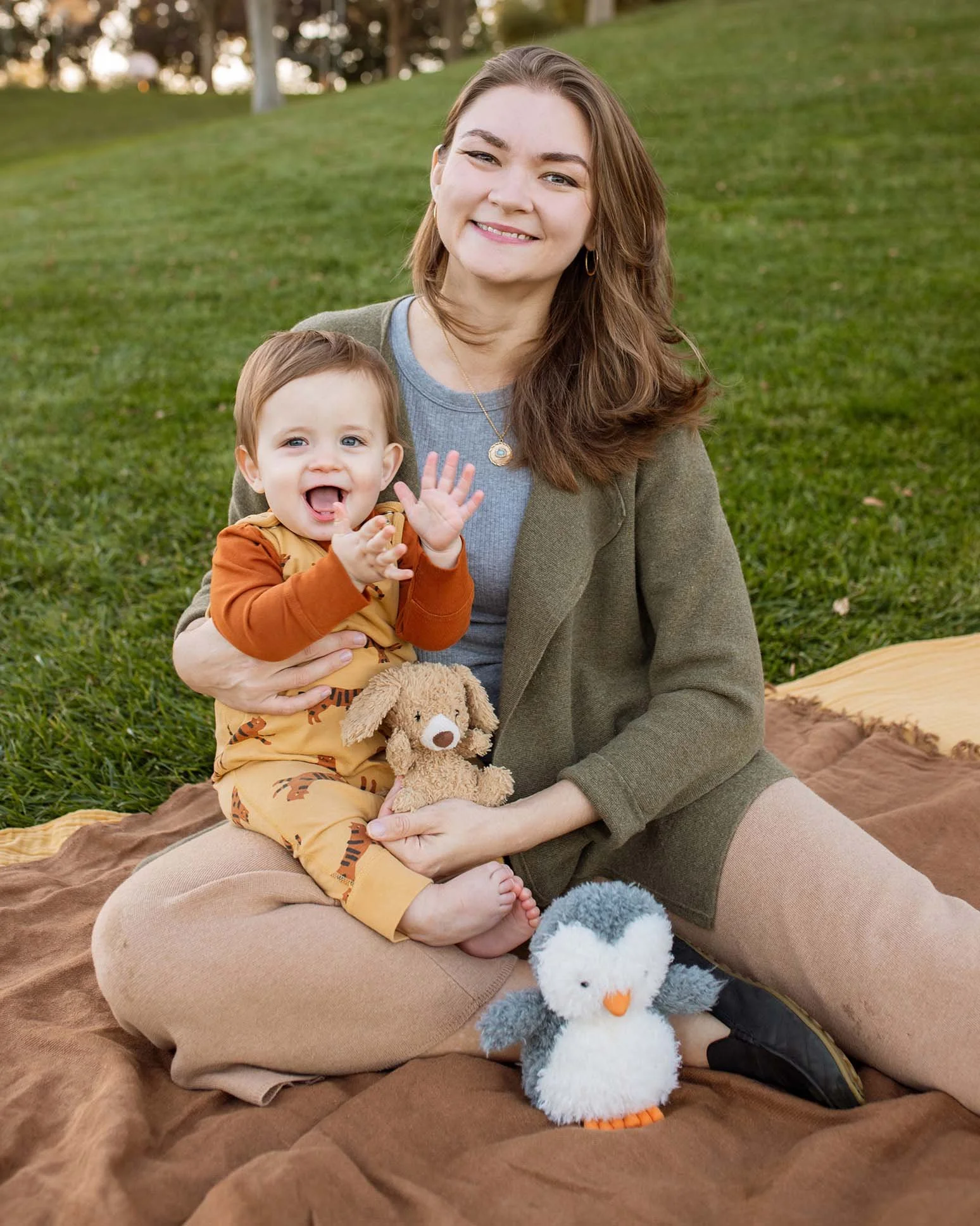 Caitlyn Driehorst and her son sitting in the park