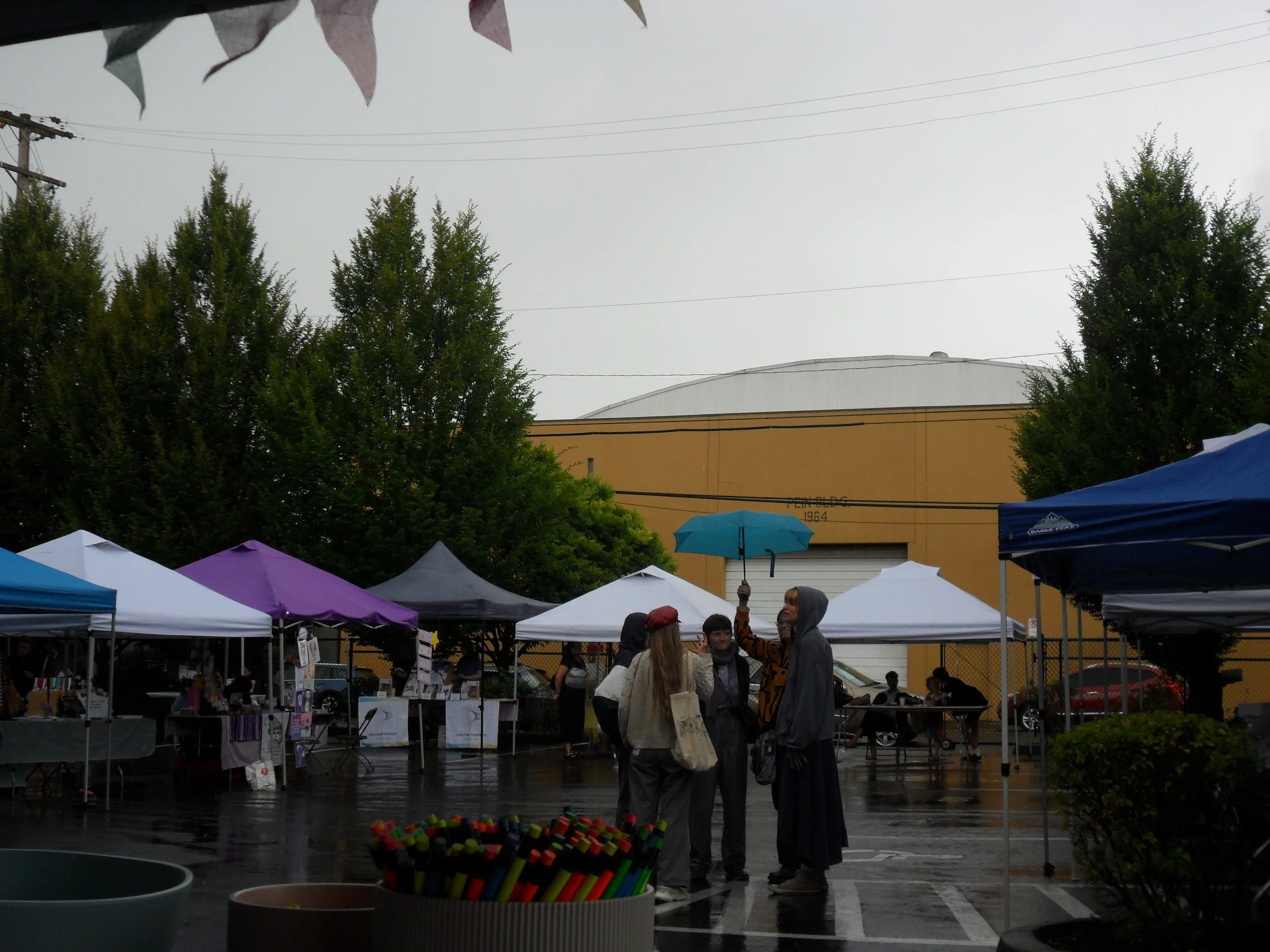 people under umbrella at PIBAf.JPG