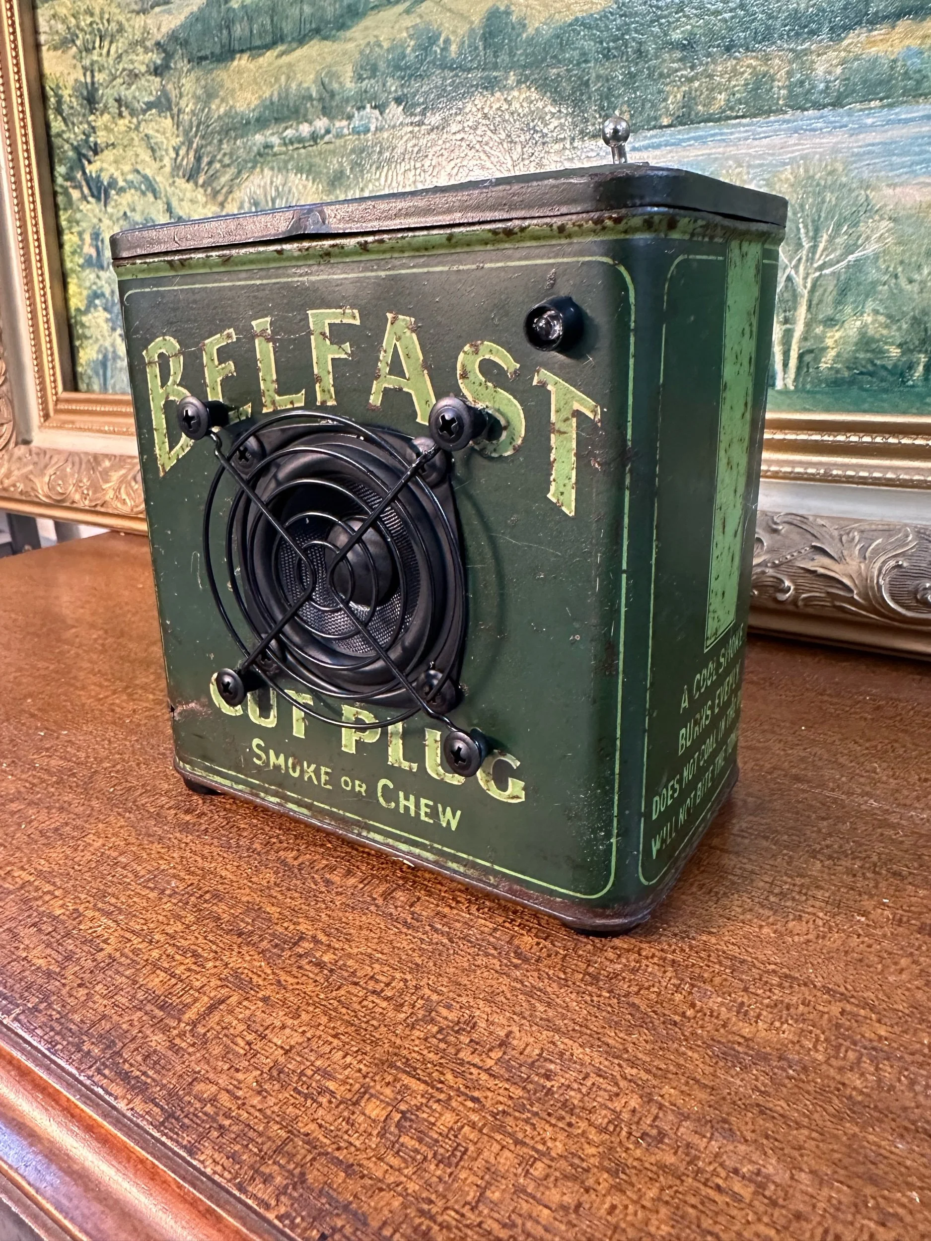 Vintage Belfast Tobacco Tin Repurposed as Speaker on Wooden Surface