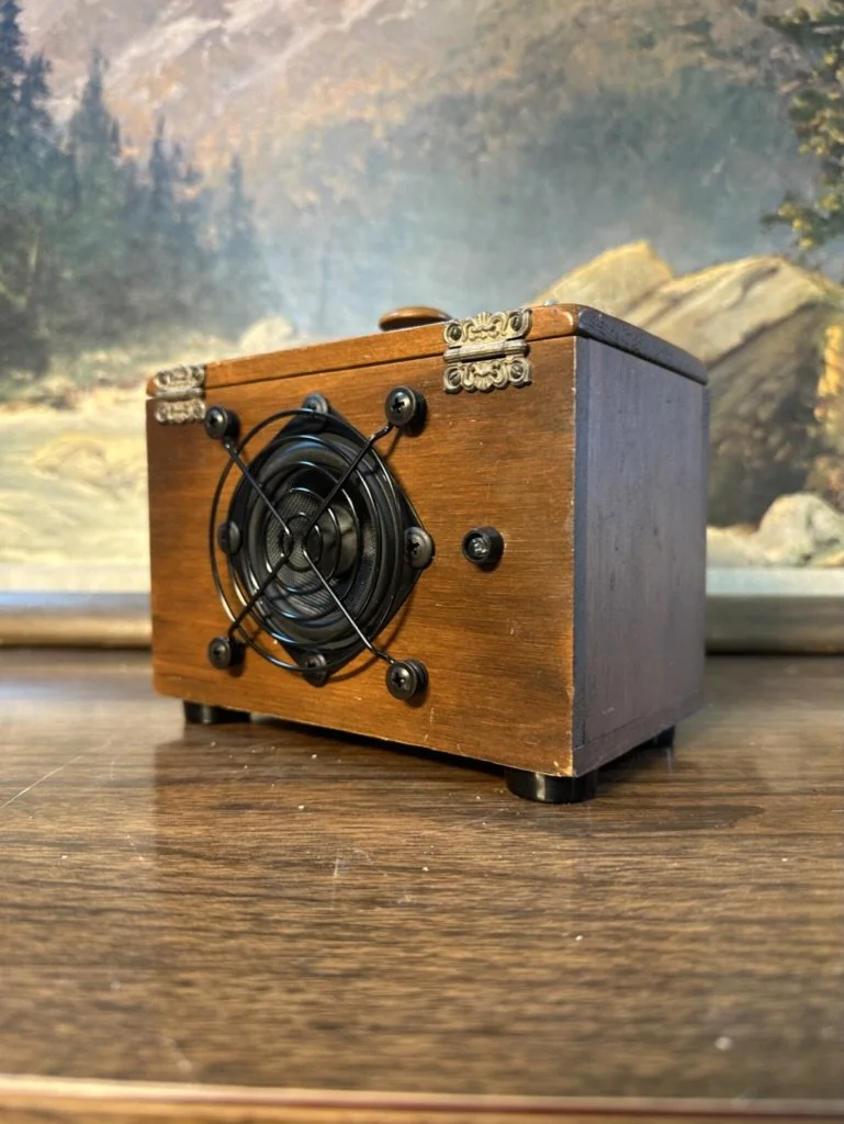Vintage wooden box speaker with metal grill