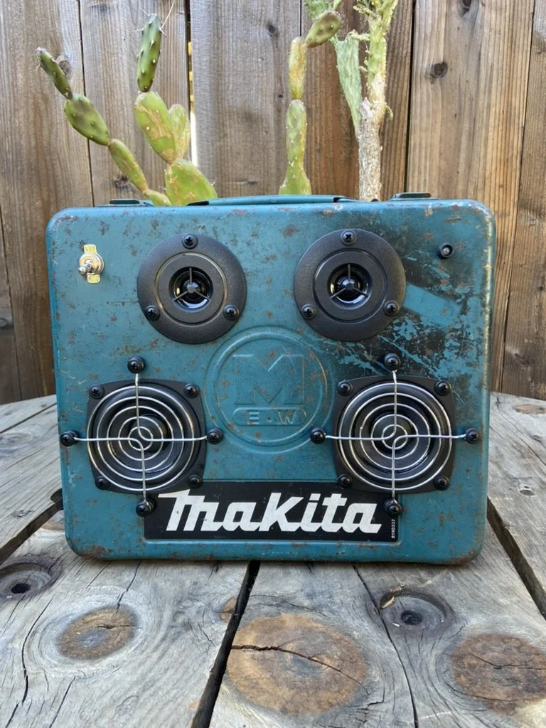 Vintage Makita-themed speaker box with multiple speaker units and a weathered, rustic appearance, set against a wooden background with cacti.