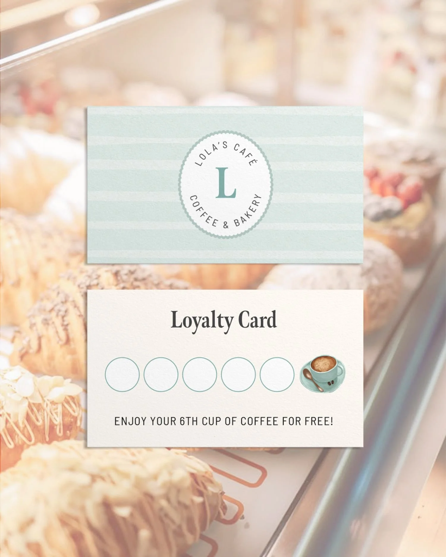 Loyalty card design mockup with blue watercolour and illustrations.