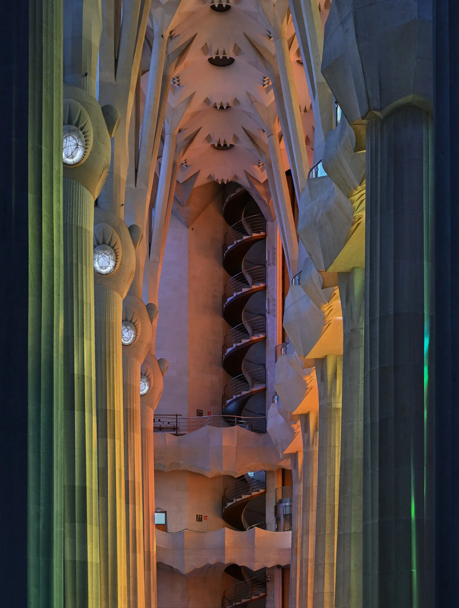 Columns illuminated by stained glass in La Sagrada Família