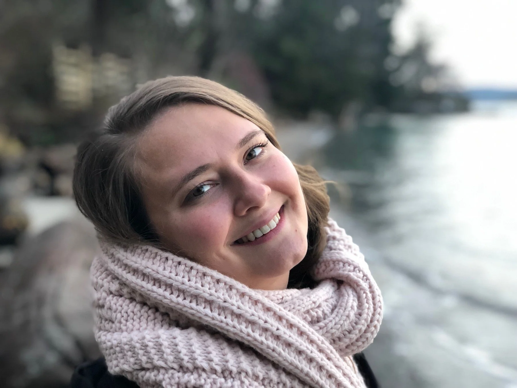 Headshot of Lauren - LDOT Designs wearing a light pink scarf and smiling at the camera