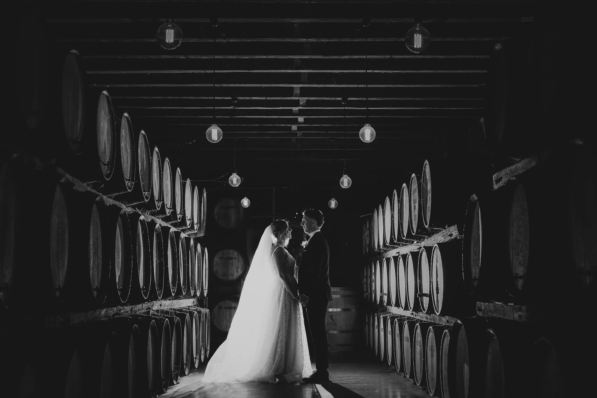 A Bride and Groom stunningly backlit in a winery cellar. Married by Anthea Teakle - Civil Celebrant.
Photo credit: Turner Studio Weddings & Portraits